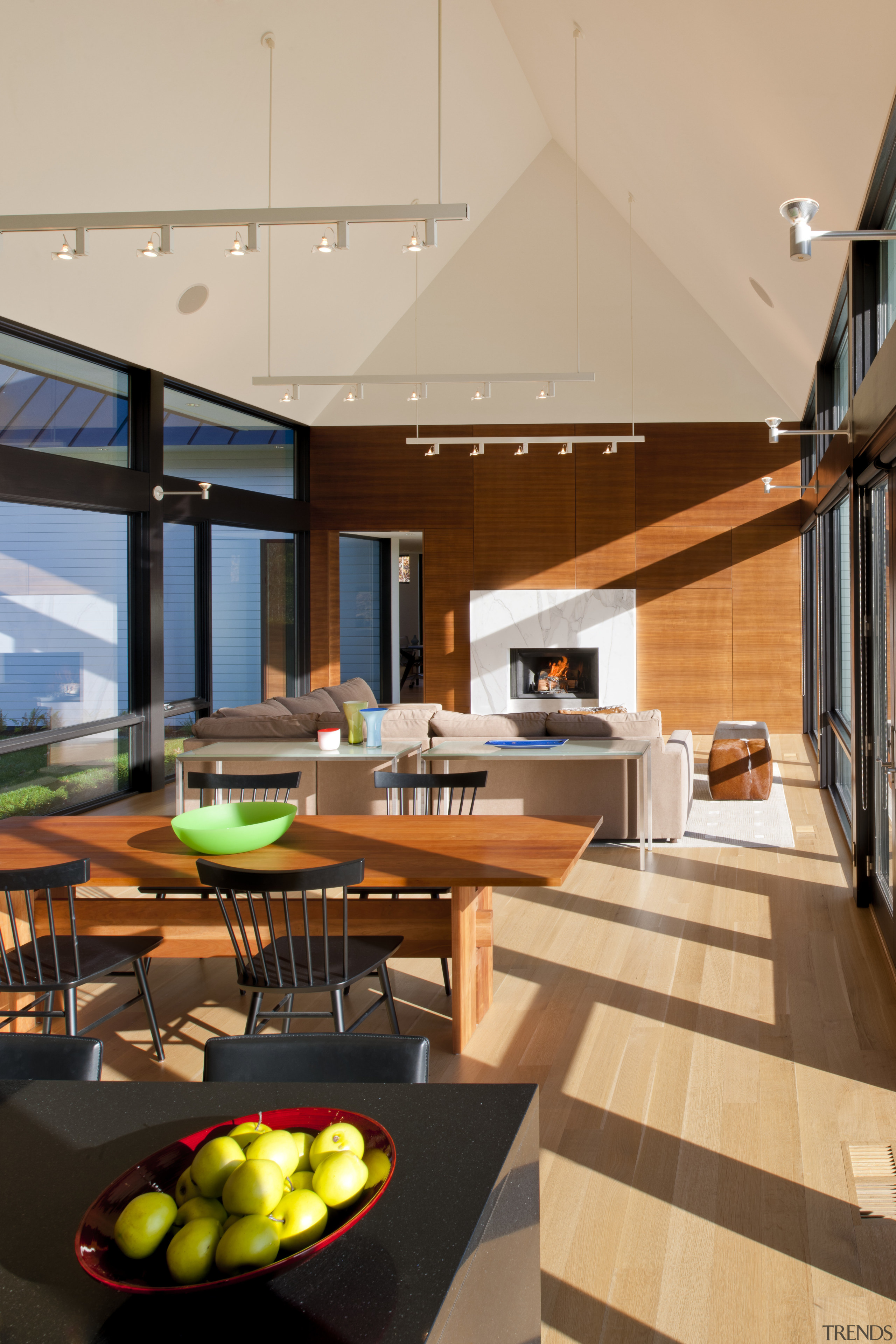 This large living pavilion in a contemporary country architecture, ceiling, daylighting, house, interior design, living room, real estate, table, orange