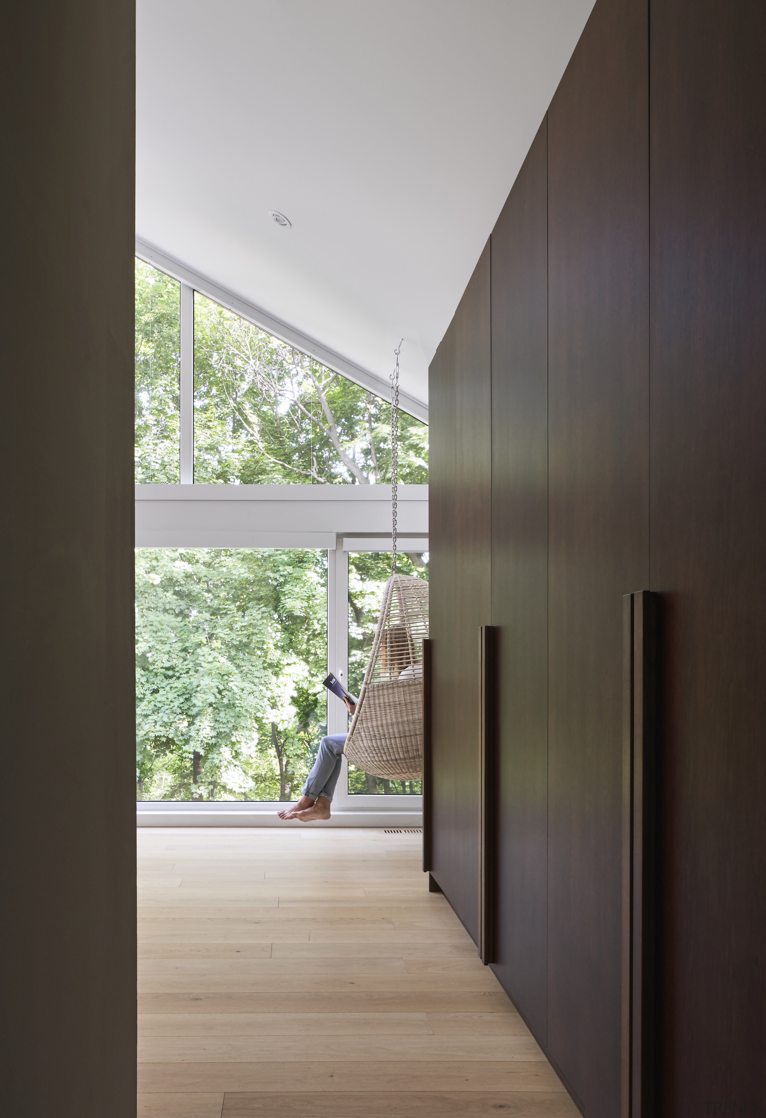 A bank of dark-toned wood cabinetry contrasts the 