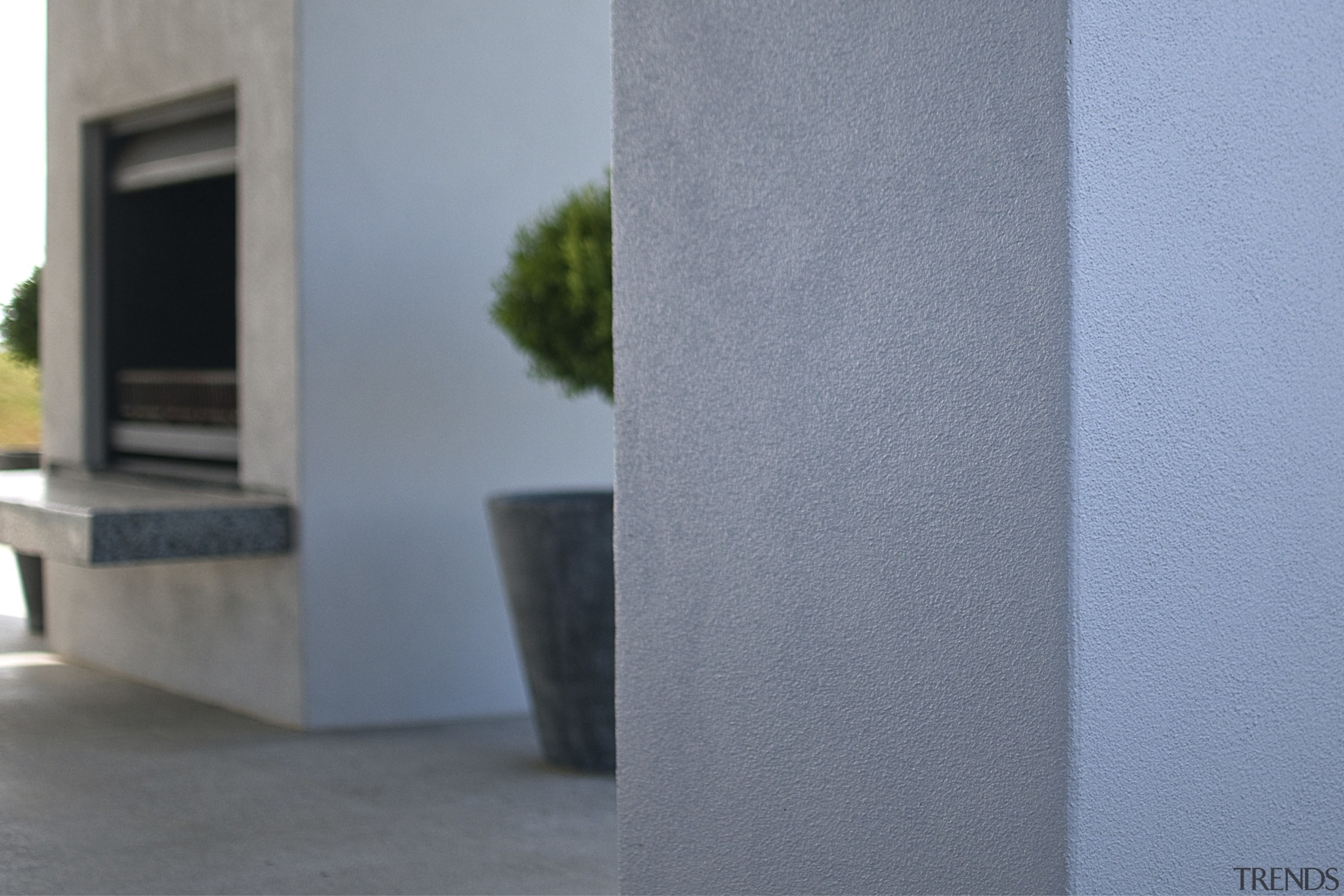 View of a house which is clad in angle, architecture, concrete, daylighting, house, structure, wall, window, gray, teal