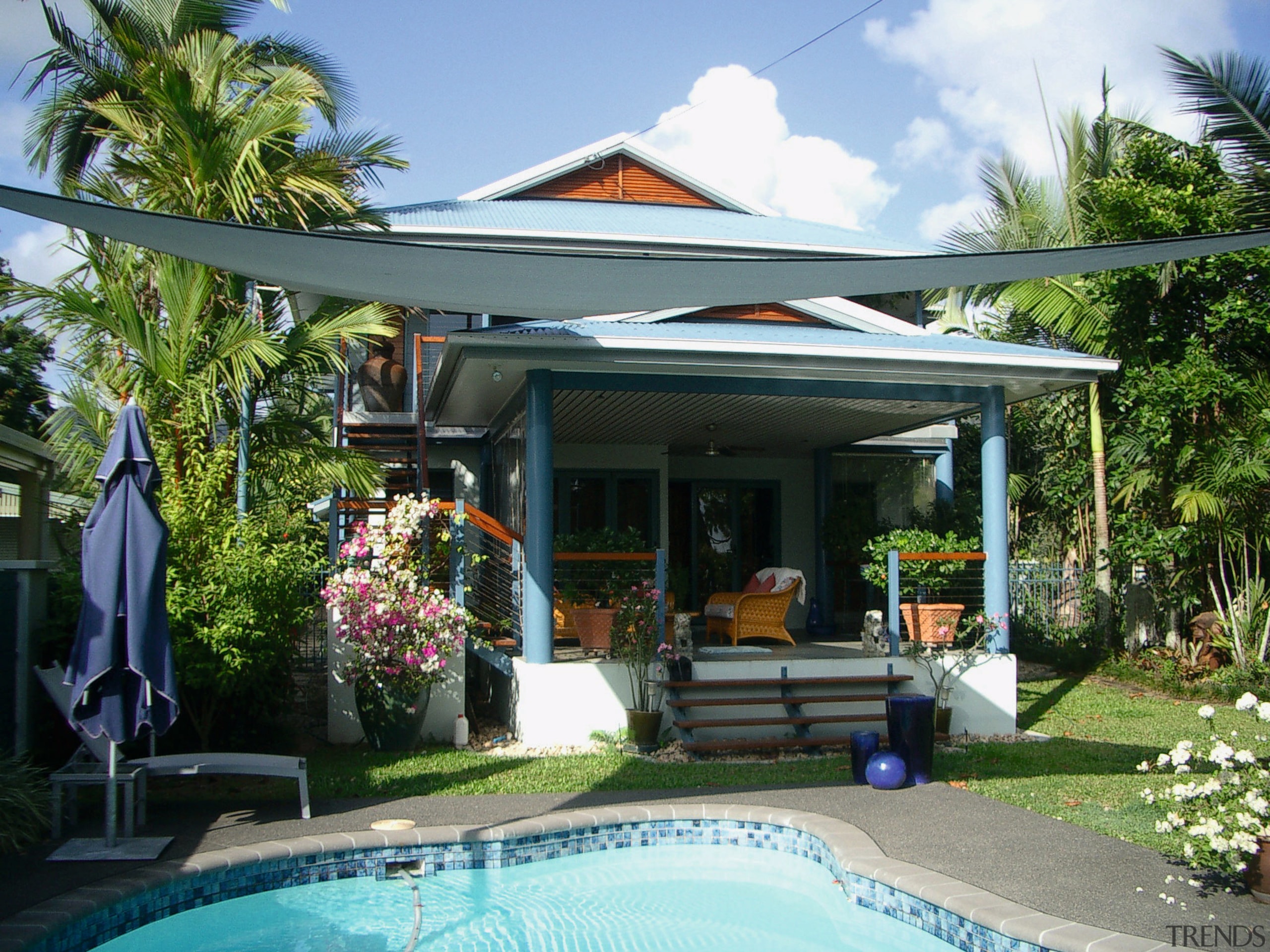 Exterior of home with shade sails, pool, decking arecales, backyard, cottage, estate, home, house, leisure, outdoor structure, palm tree, property, real estate, resort, roof, swimming pool, villa