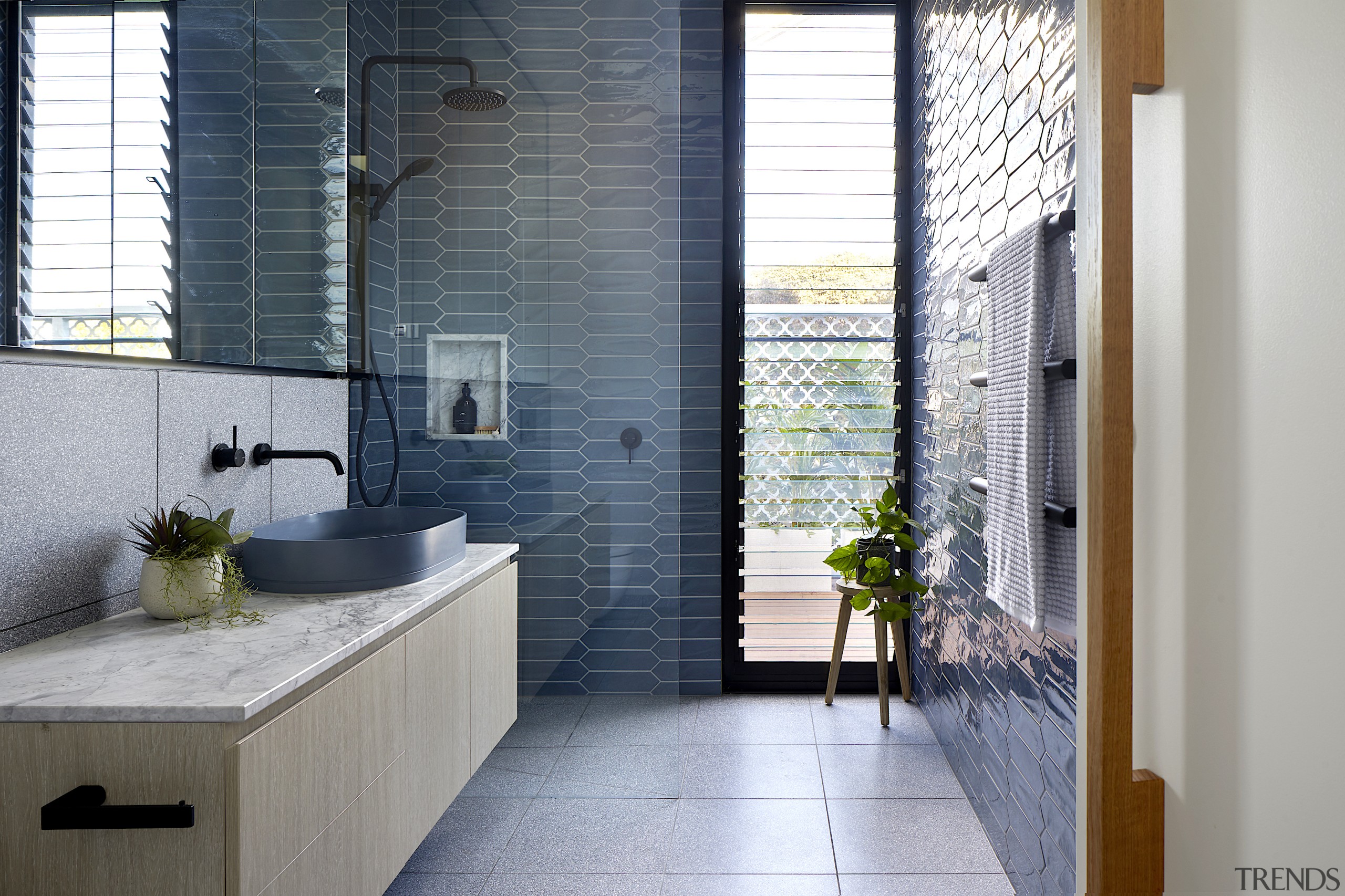 The sun-drenched bathroom takes full advantage of its 