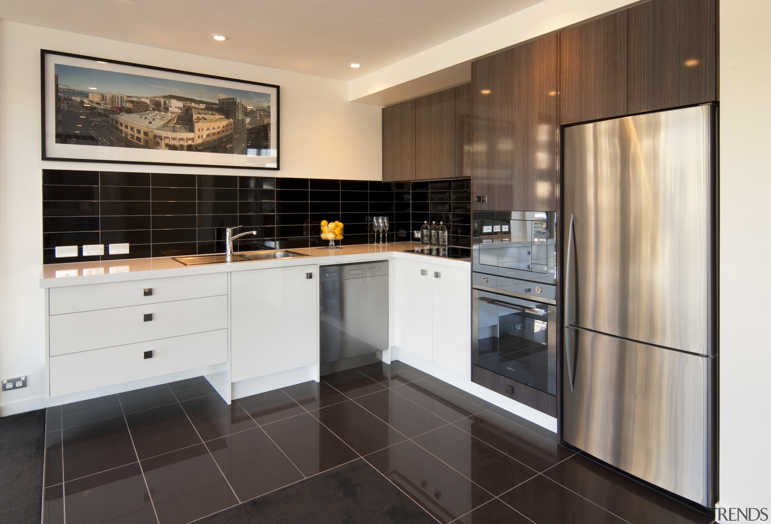 Kitchen with brown tiled flooring, stainless frige and cabinetry, countertop, cuisine classique, floor, flooring, home appliance, interior design, kitchen, property, real estate, room, white, black