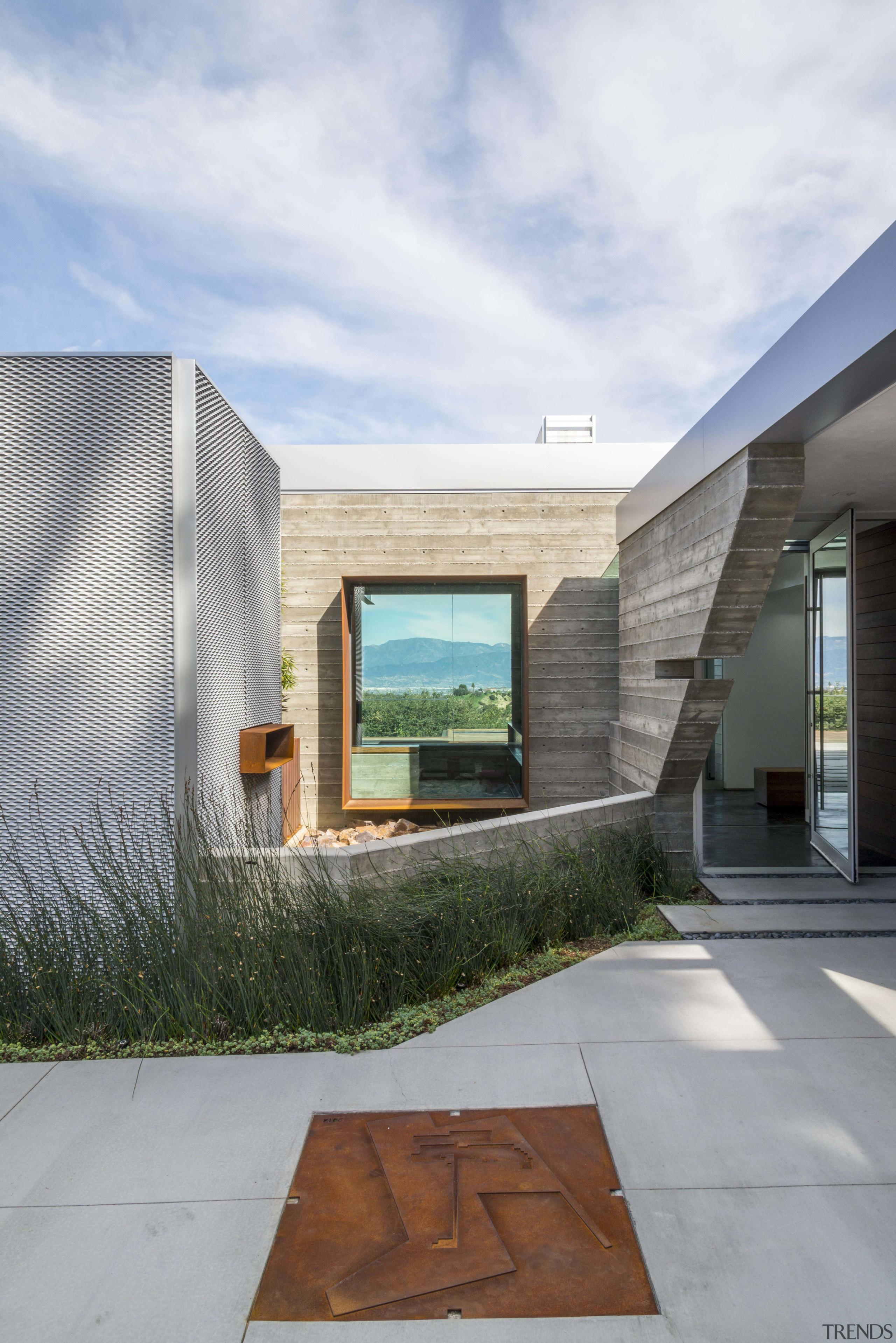 The entranceway to a property that combines a architecture, facade, home, house, real estate, residential area, white, gray