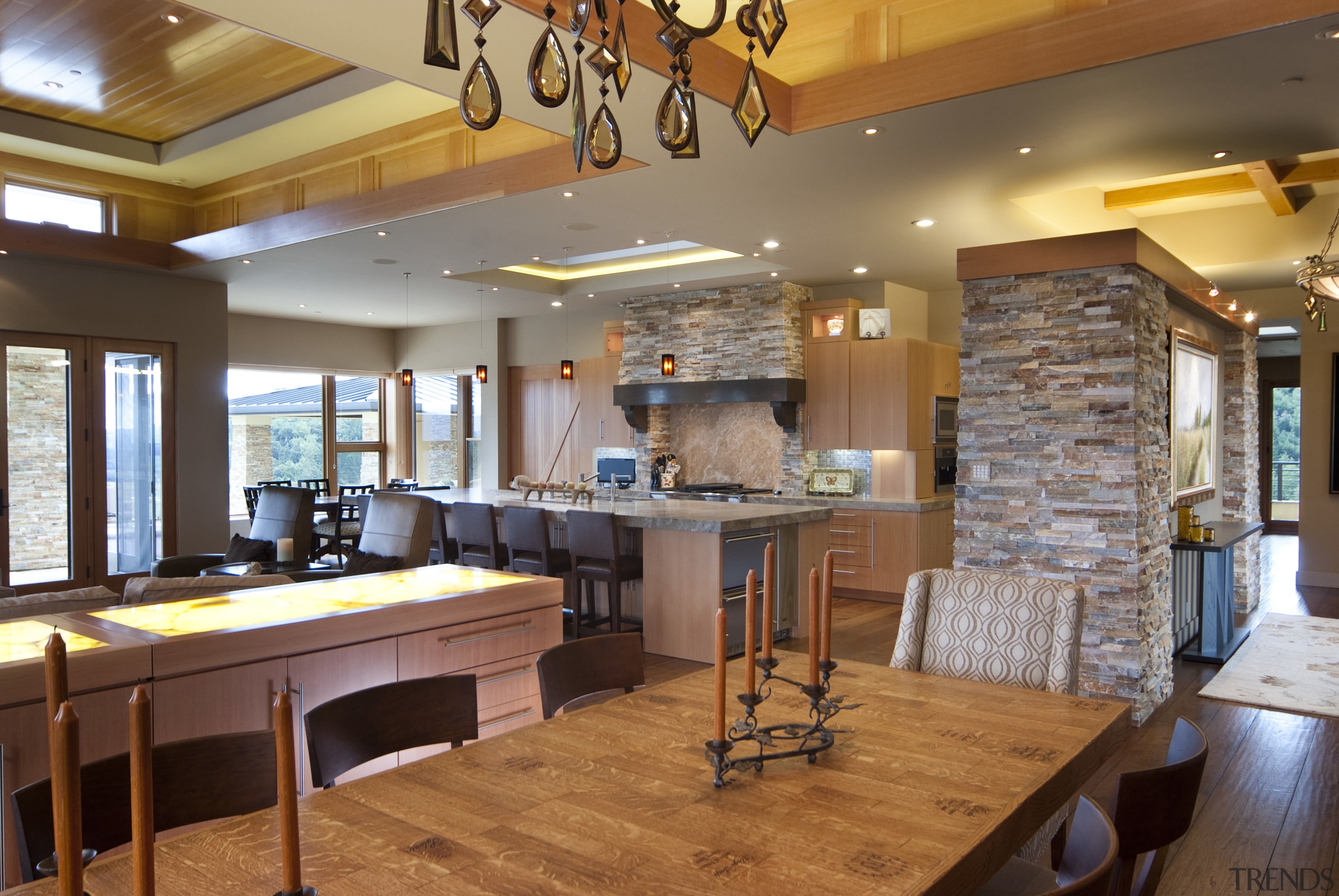 View of kitchen with wooden flooring, stone wall ceiling, countertop, interior design, kitchen, real estate, room, brown