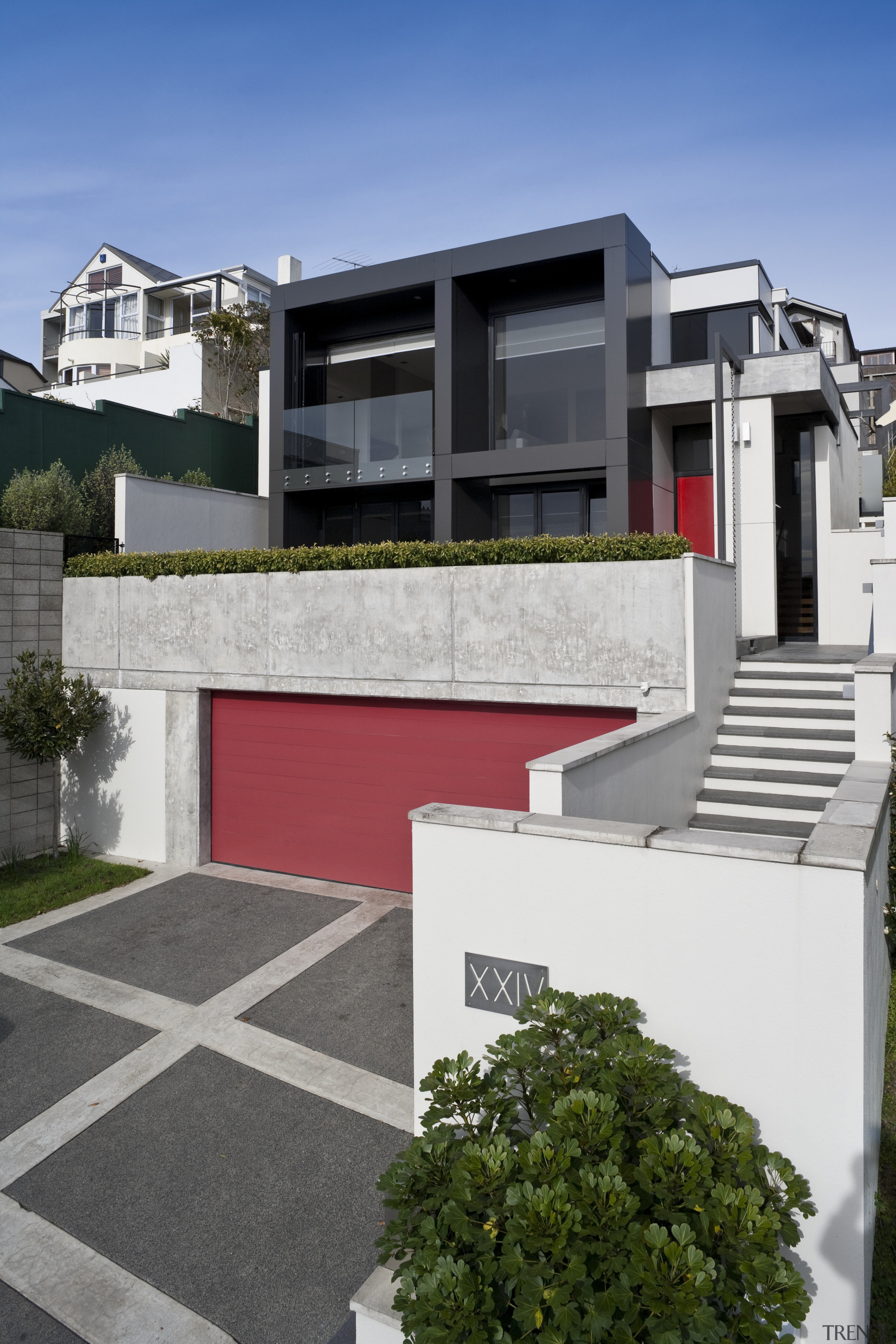 View of the exterior featuring concrete, aluminum cladding architecture, building, elevation, facade, home, house, neighbourhood, property, real estate, residential area, suburb, white