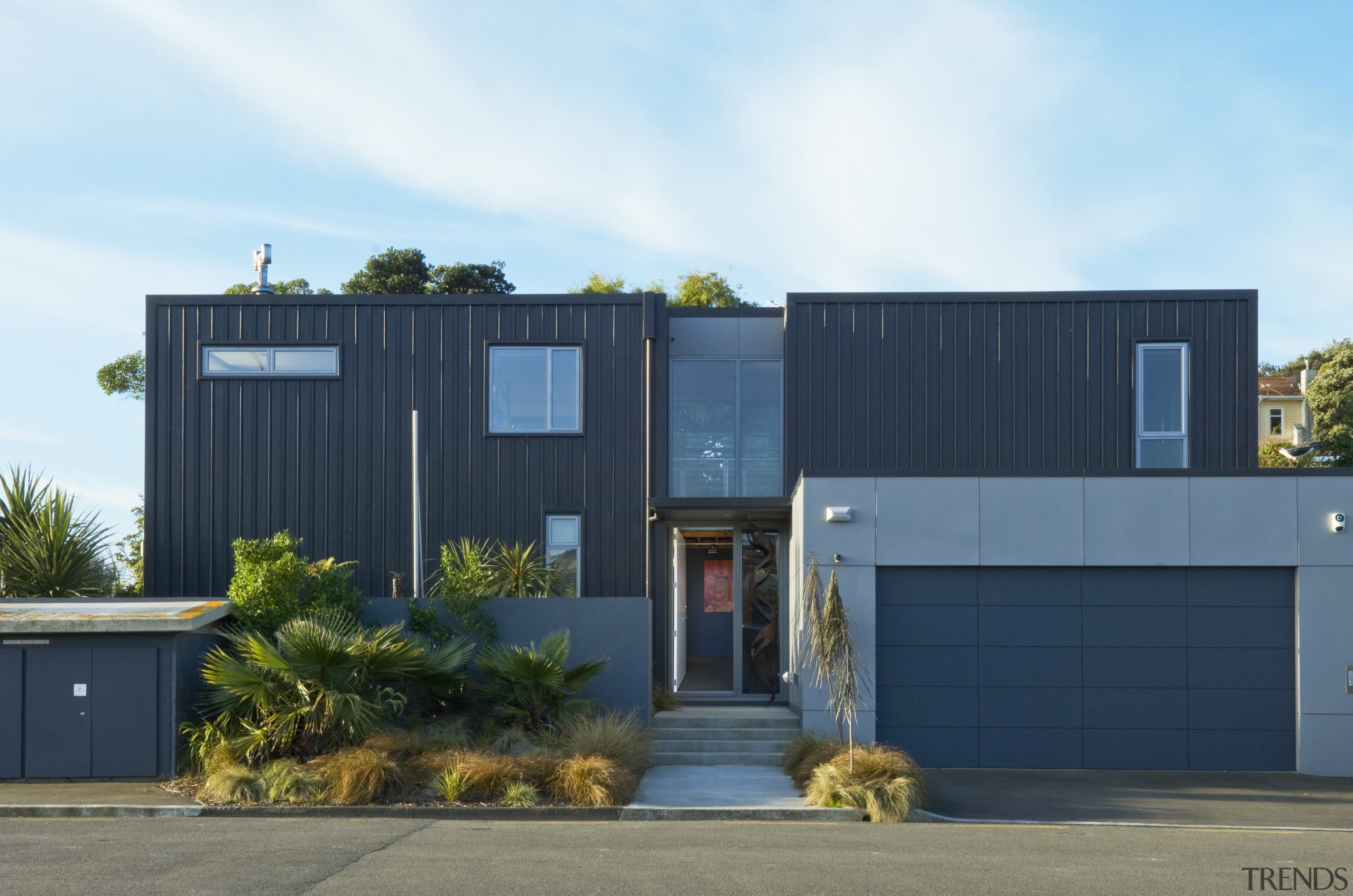 Exterior view of home with two large square architecture, elevation, facade, home, house, property, real estate, residential area, shed, shipping container, blue