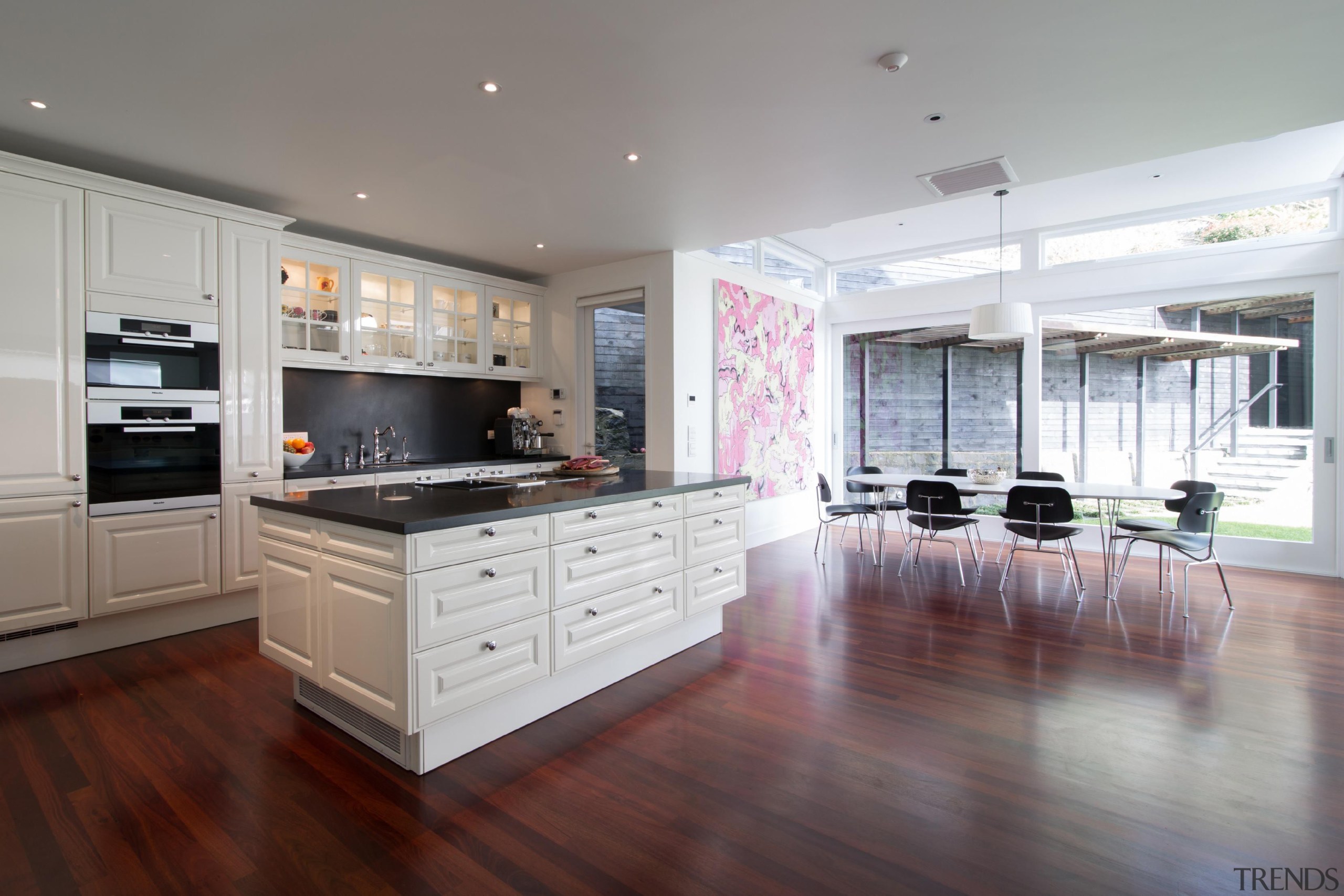 Contemporary technology is combined with timeless aesthetics and cabinetry, countertop, cuisine classique, floor, flooring, hardwood, interior design, kitchen, laminate flooring, property, real estate, room, wood flooring, gray