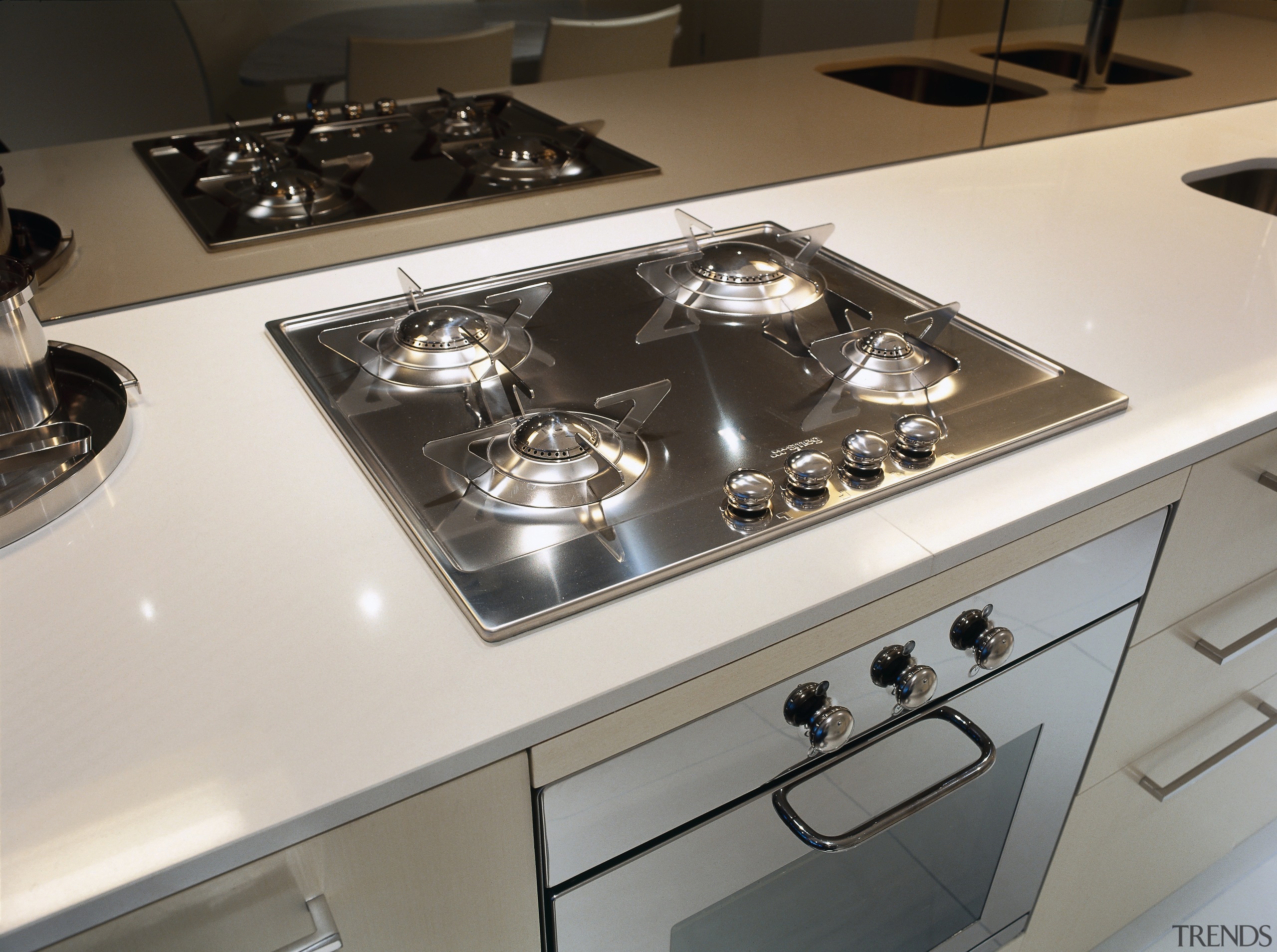 view of this kitchen in yve apartments featuring countertop, gas stove, home appliance, kitchen, kitchen stove, product design, white, gray