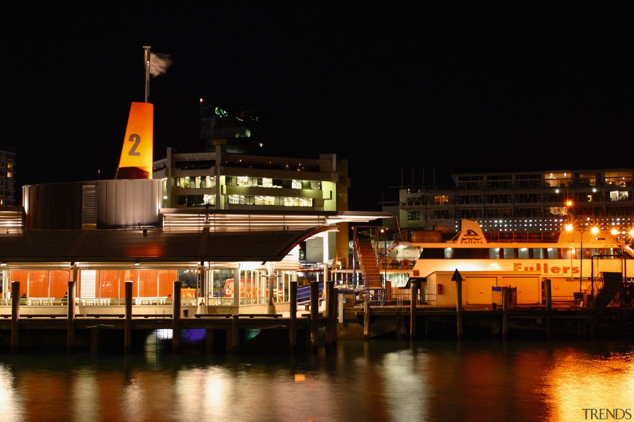 External view of the new Ferry Terminal in city, cityscape, evening, harbor, lighting, marina, night, reflection, sky, water, black, brown
