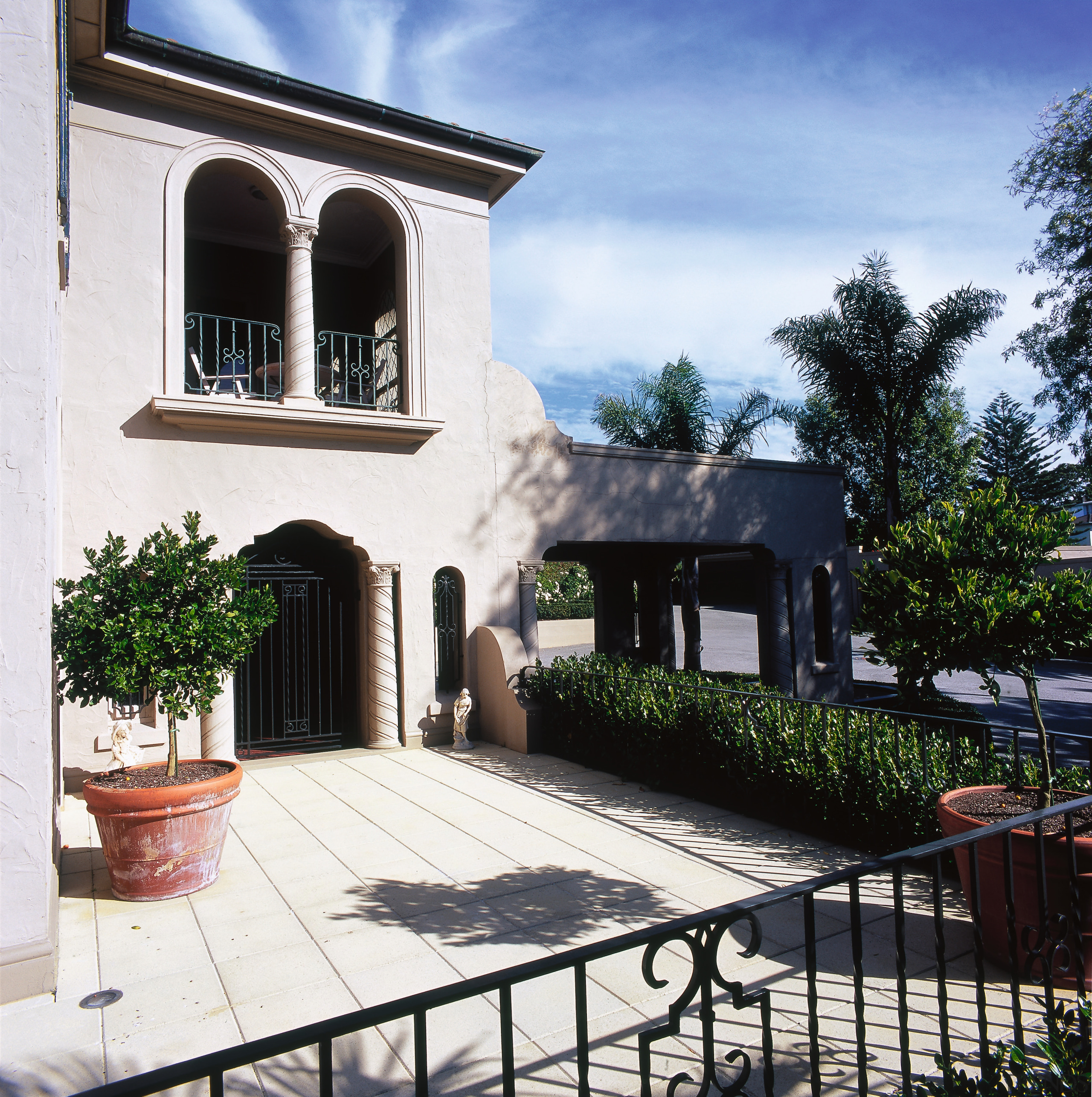 view of the kumquat trees  in terracotta building, courtyard, estate, facade, hacienda, home, house, mansion, outdoor structure, property, real estate, residential area, villa, window, white, black