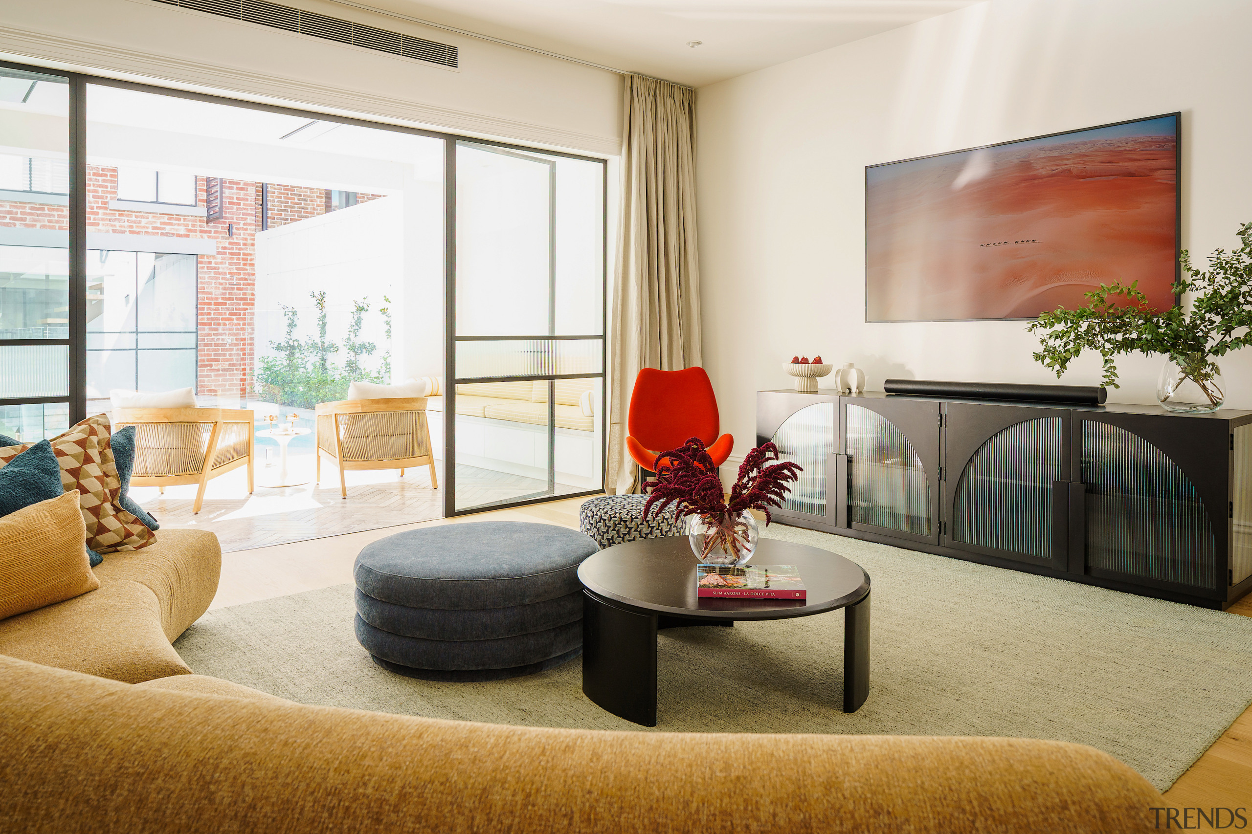 Reinvented living room with indoor-outdoor space beyond. 