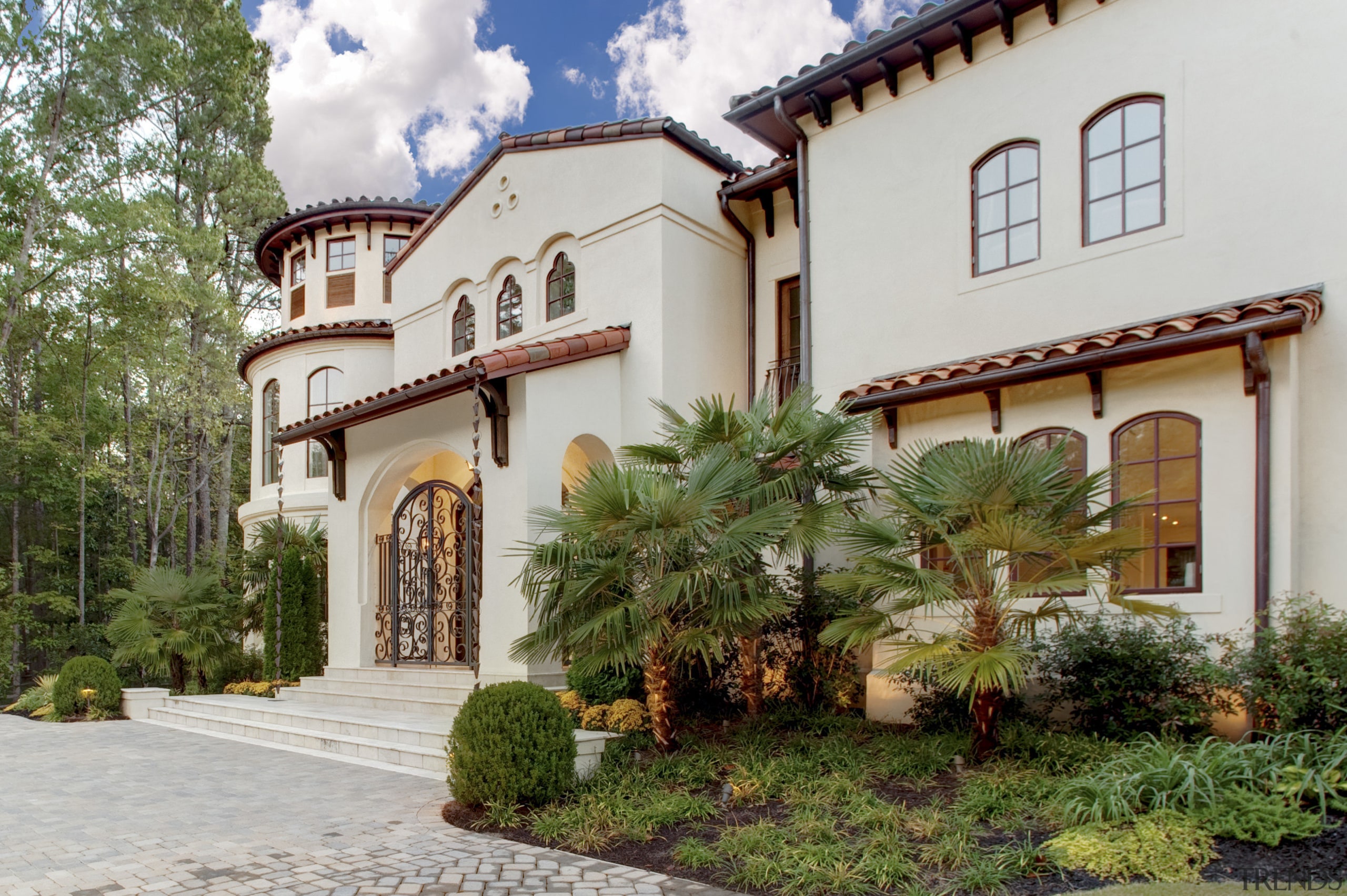 View of traditional home. - View of traditional building, courtyard, estate, facade, hacienda, home, house, mansion, property, real estate, villa, gray, brown