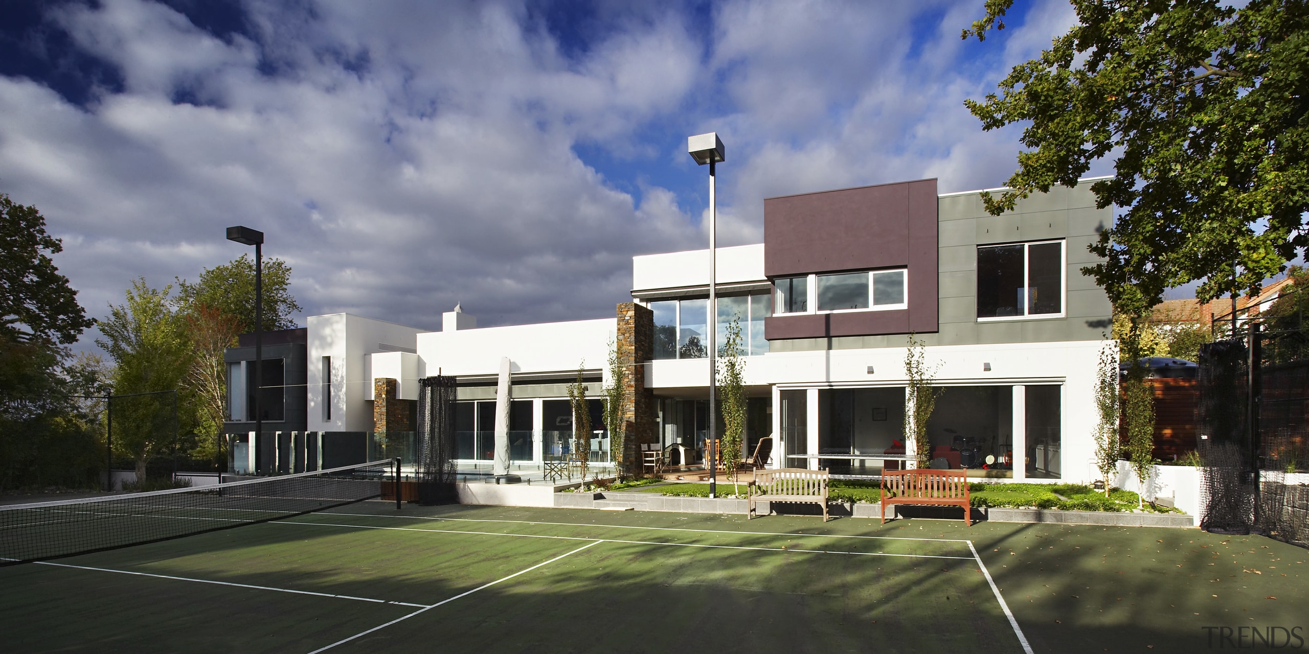 An upstairs deck is accessed from the bedrooms. apartment, architecture, building, corporate headquarters, elevation, estate, facade, home, house, mansion, mixed use, neighbourhood, property, real estate, residential area, sky, villa, black