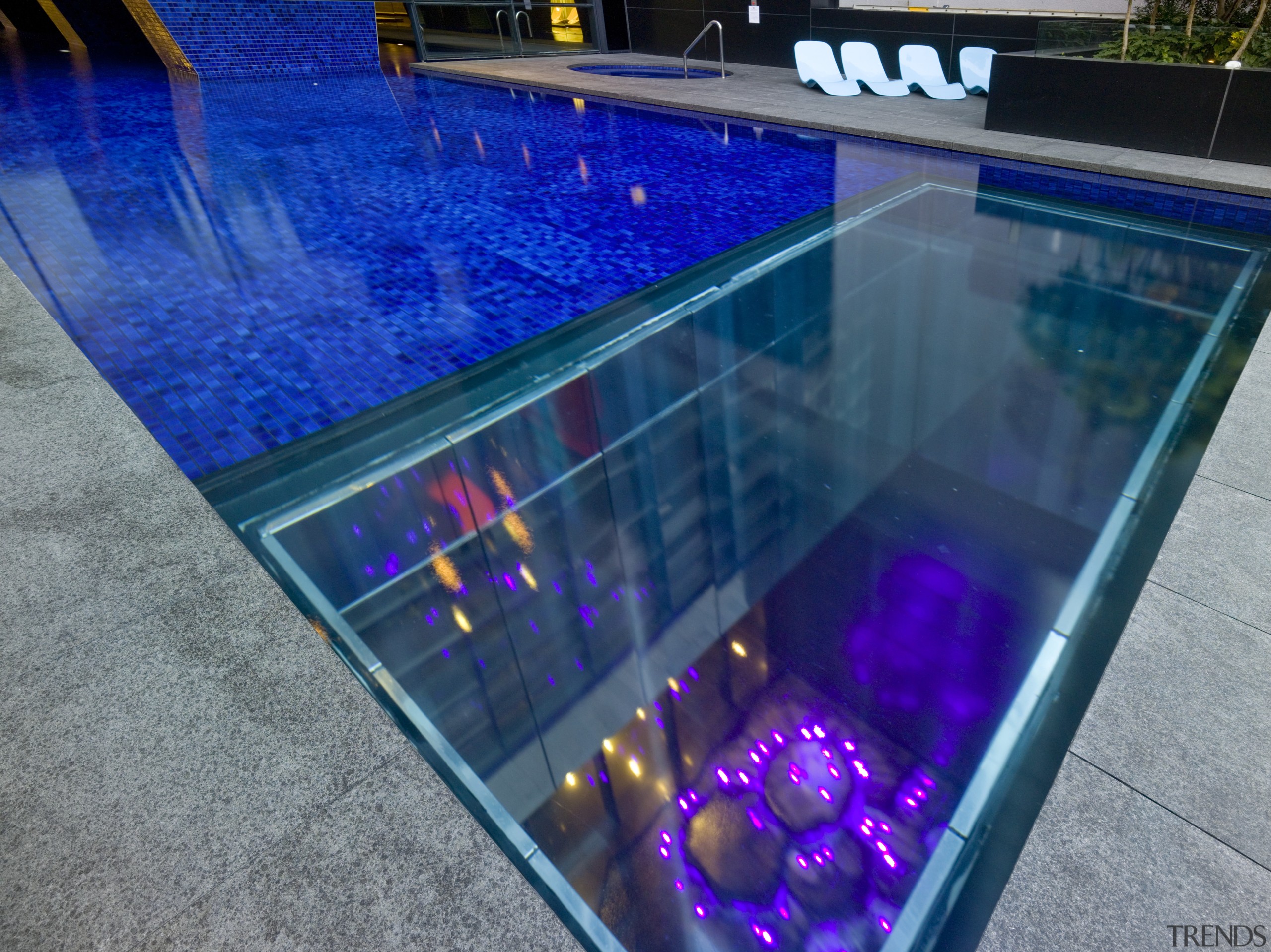 Contemporary apartment building outdoor swimming pool glass, light, lighting, swimming pool, water, blue, gray