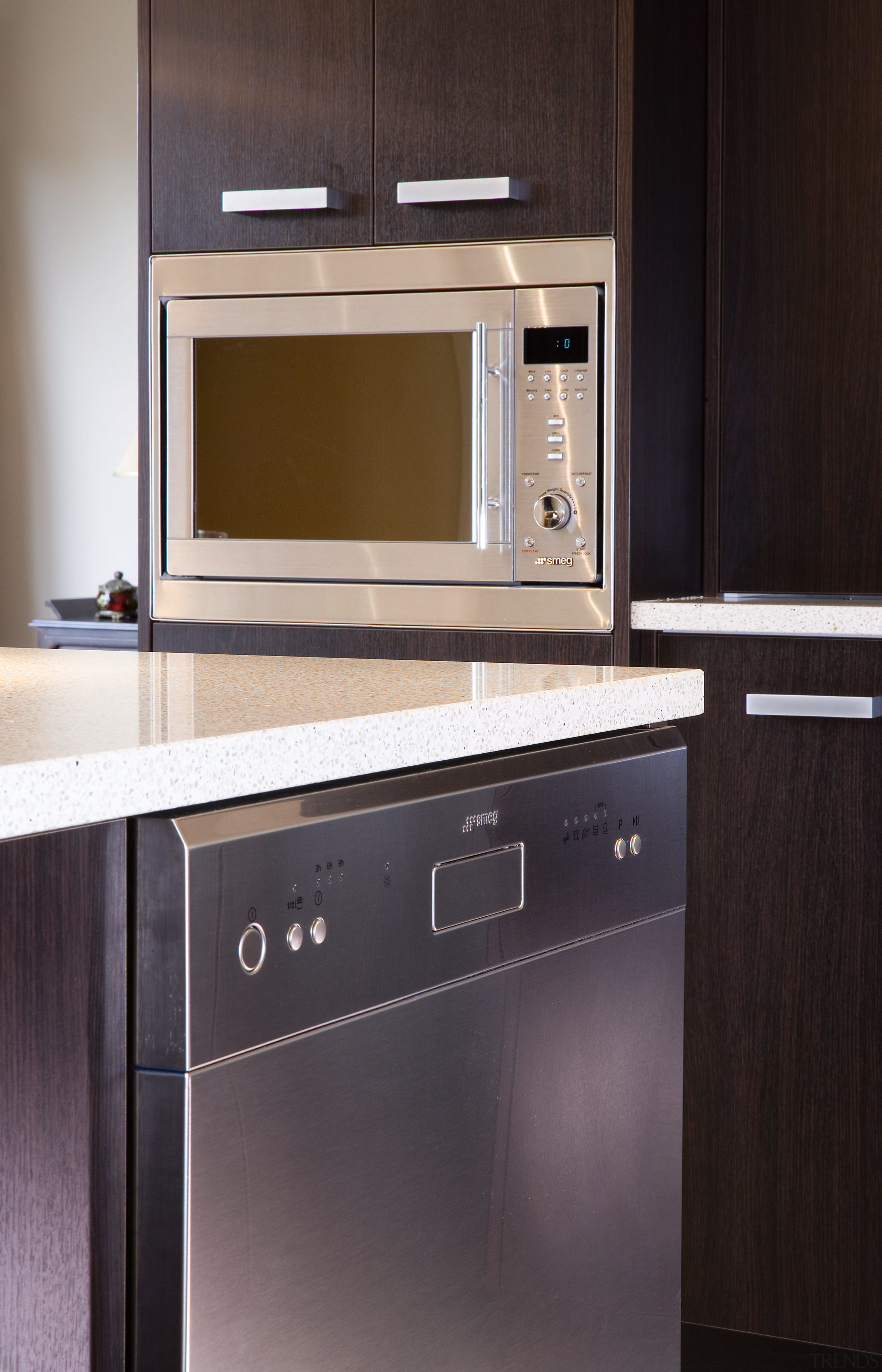 A view of some Smeg kitchen appliances. - cabinetry, countertop, furniture, home appliance, kitchen, kitchen appliance, kitchen stove, major appliance, microwave oven, oven, product, black, gray