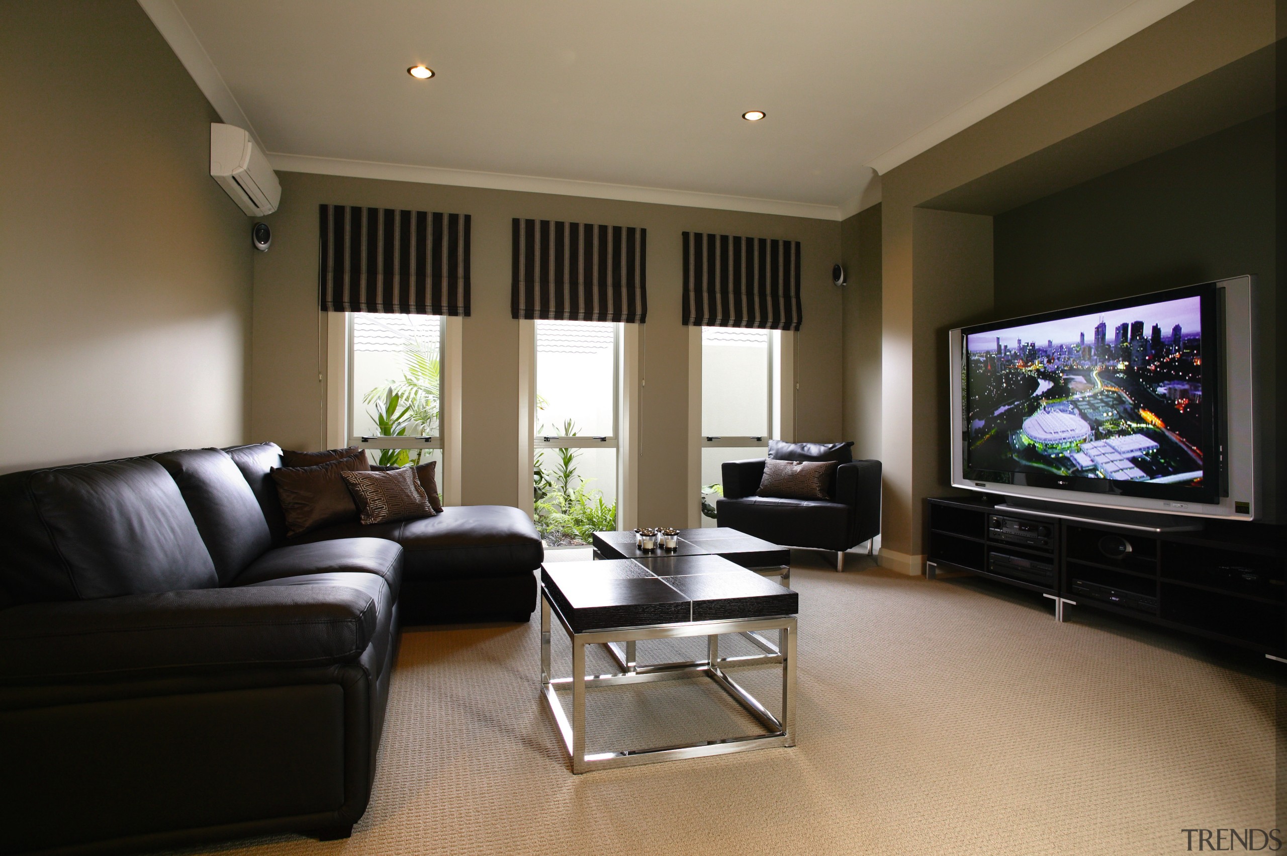 A view of an air conditioning system from ceiling, floor, home, interior design, living room, property, real estate, room, suite, black, brown