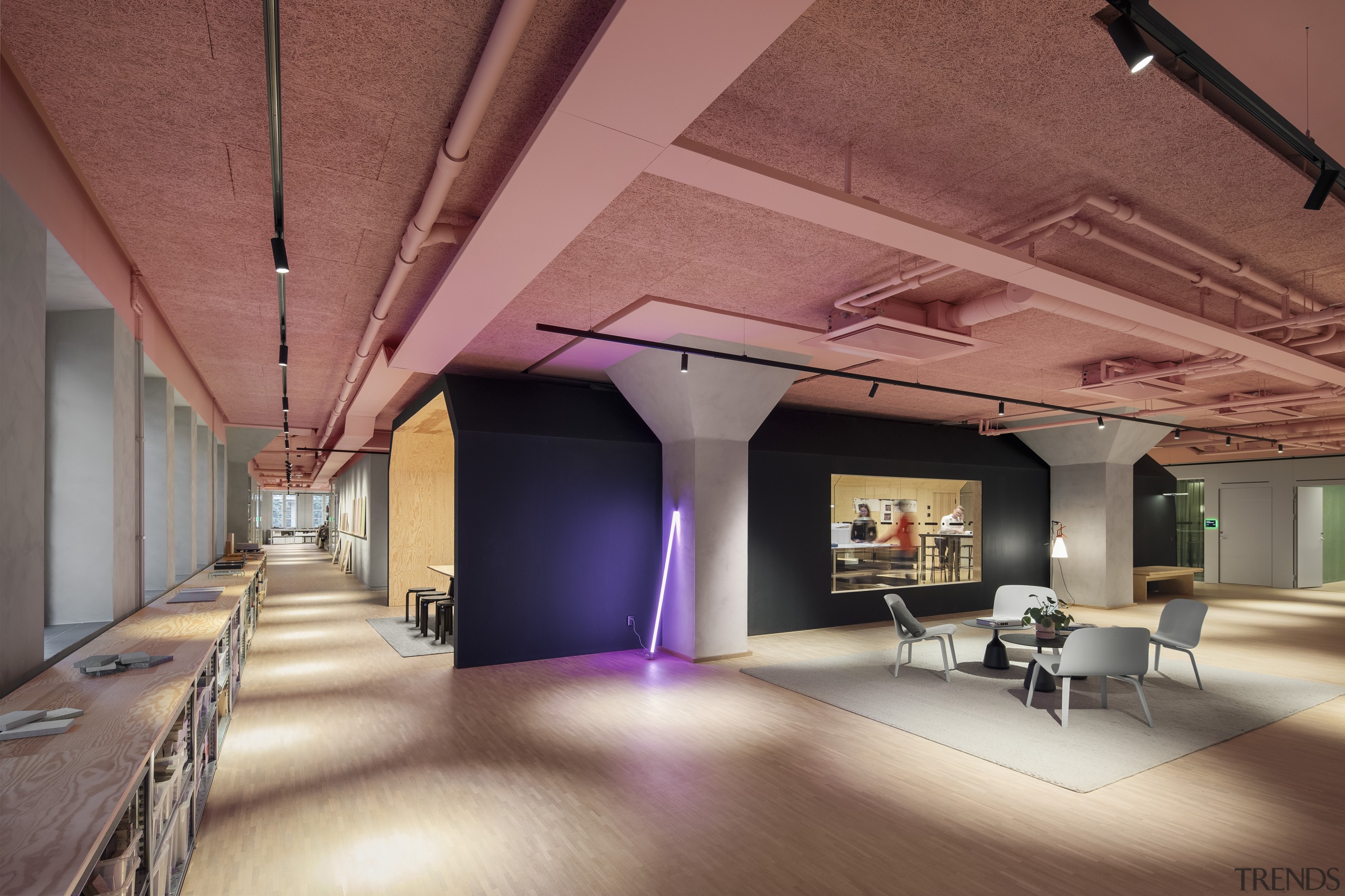 The exposed ceilings are painted in a muted 
