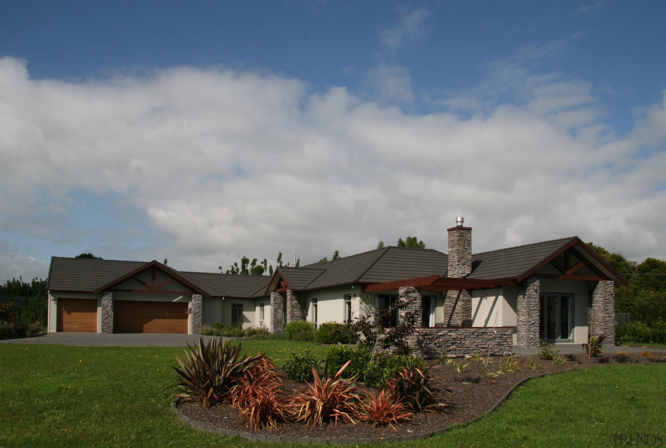 Long view of house stutex stone pillars - cloud, cottage, estate, facade, farmhouse, grass, home, house, land lot, landscape, landscaping, outdoor structure, property, real estate, residential area, roof, rural area, sky, suburb, tree, yard, gray