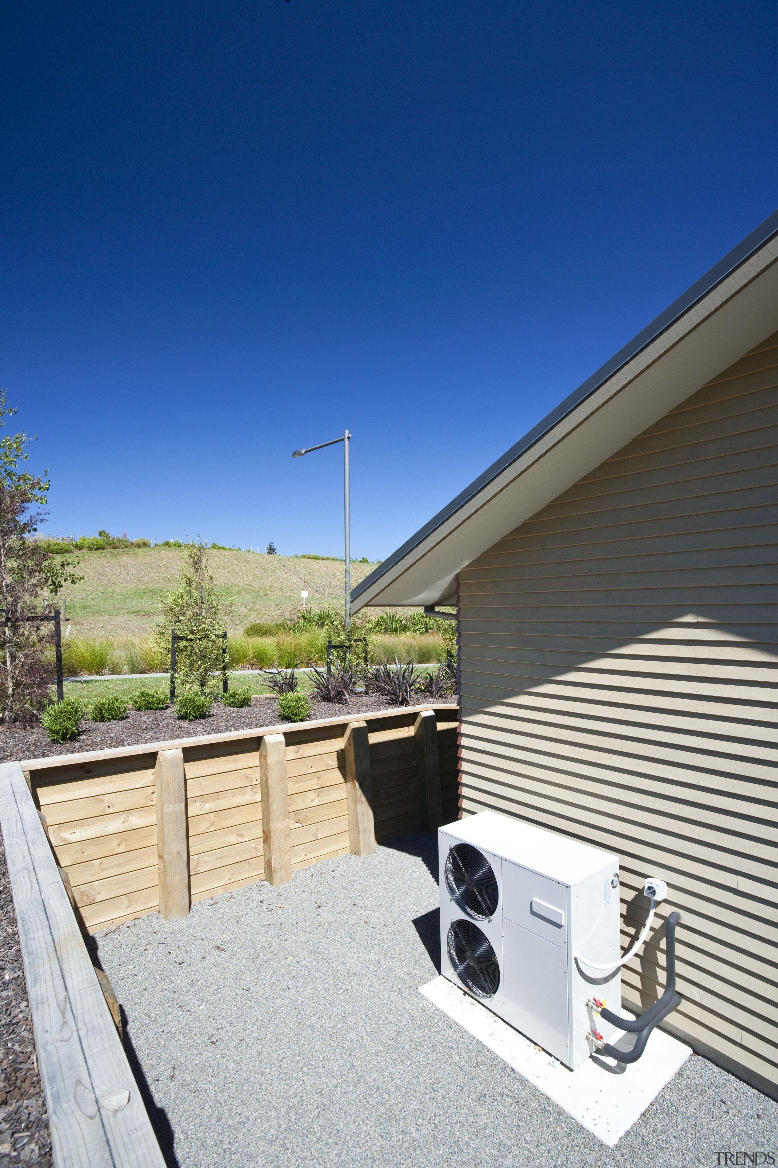 Exterior view of David Reid show home which architecture, daylighting, facade, home, house, property, real estate, residential area, roof, siding, sky, window, blue, white