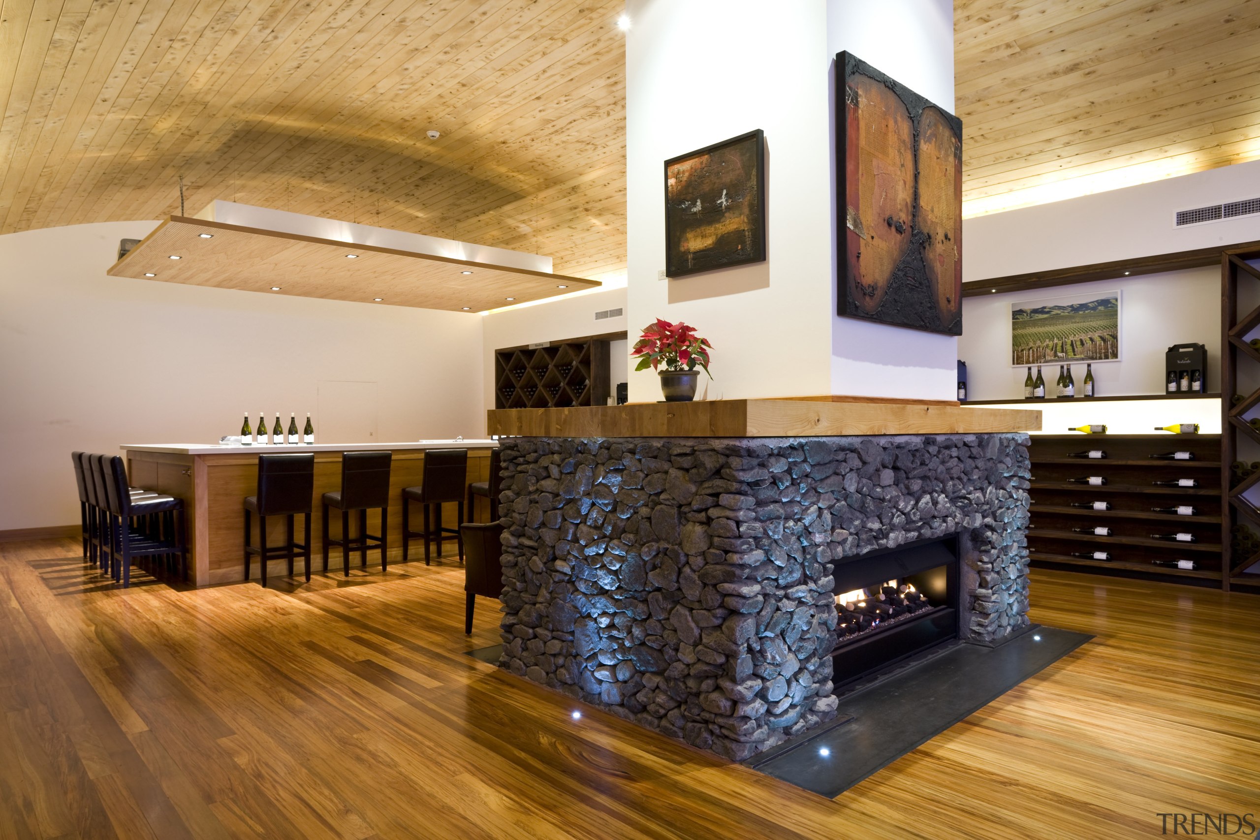 View of a bar and eating area which fireplace, floor, flooring, hardwood, hearth, interior design, laminate flooring, living room, lobby, real estate, wood, wood flooring, orange