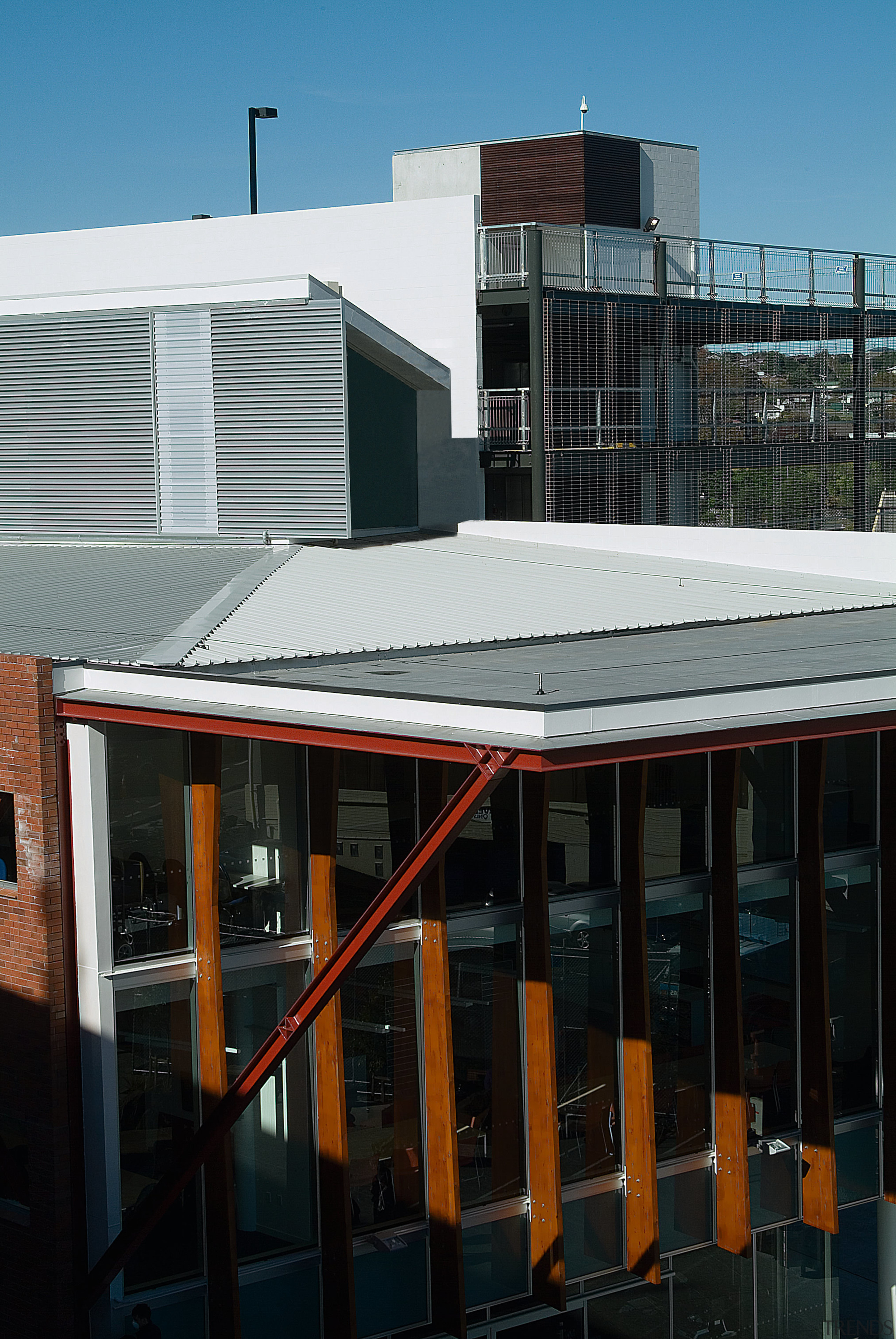 Exterior view of building showing grey roofing, and architecture, building, city, daylighting, facade, house, metropolitan area, residential area, roof, urban area, window, black