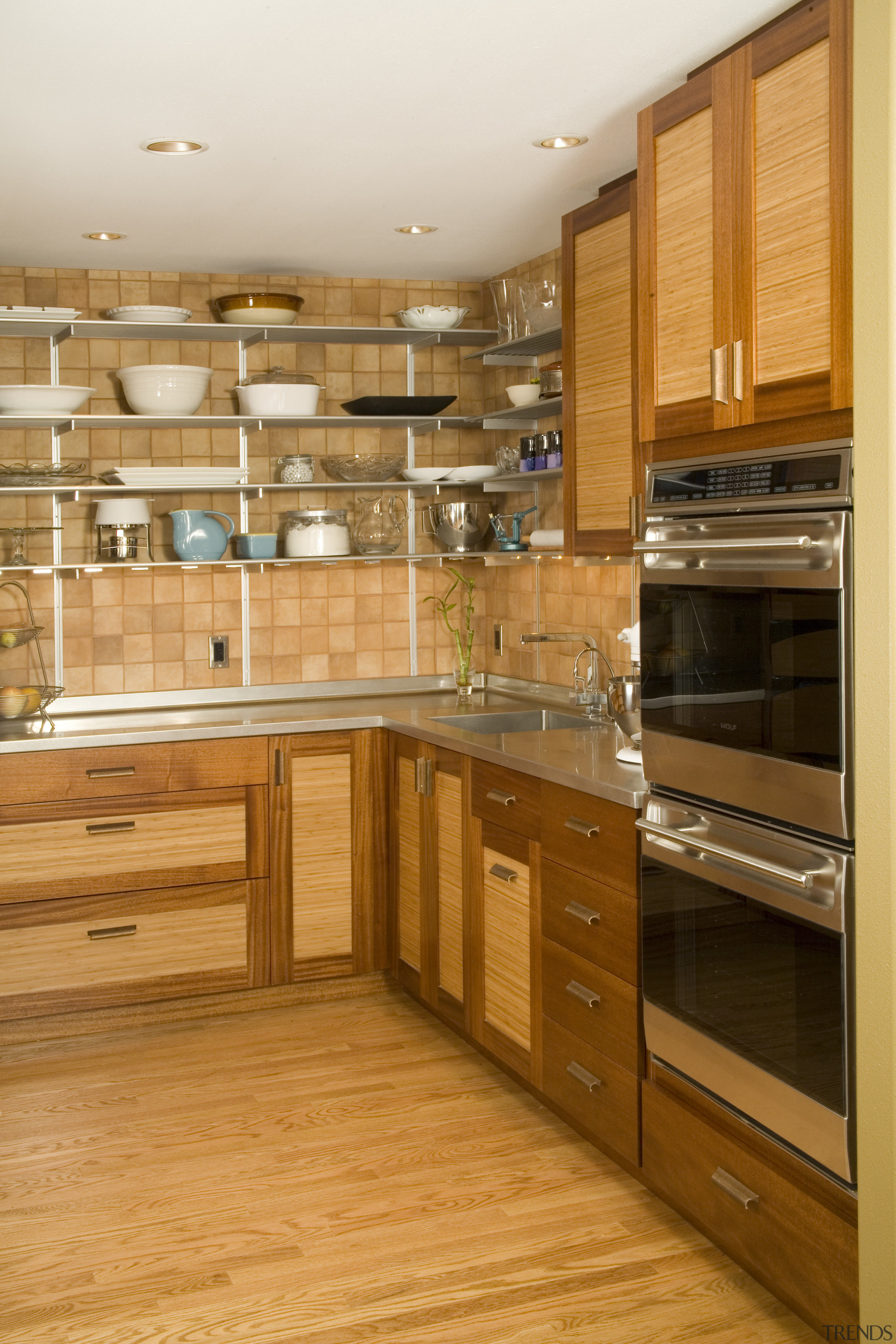 Close view of the ovens and cabinetry - cabinetry, countertop, cuisine classique, floor, flooring, hardwood, interior design, kitchen, room, wood, wood flooring, wood stain, orange, brown