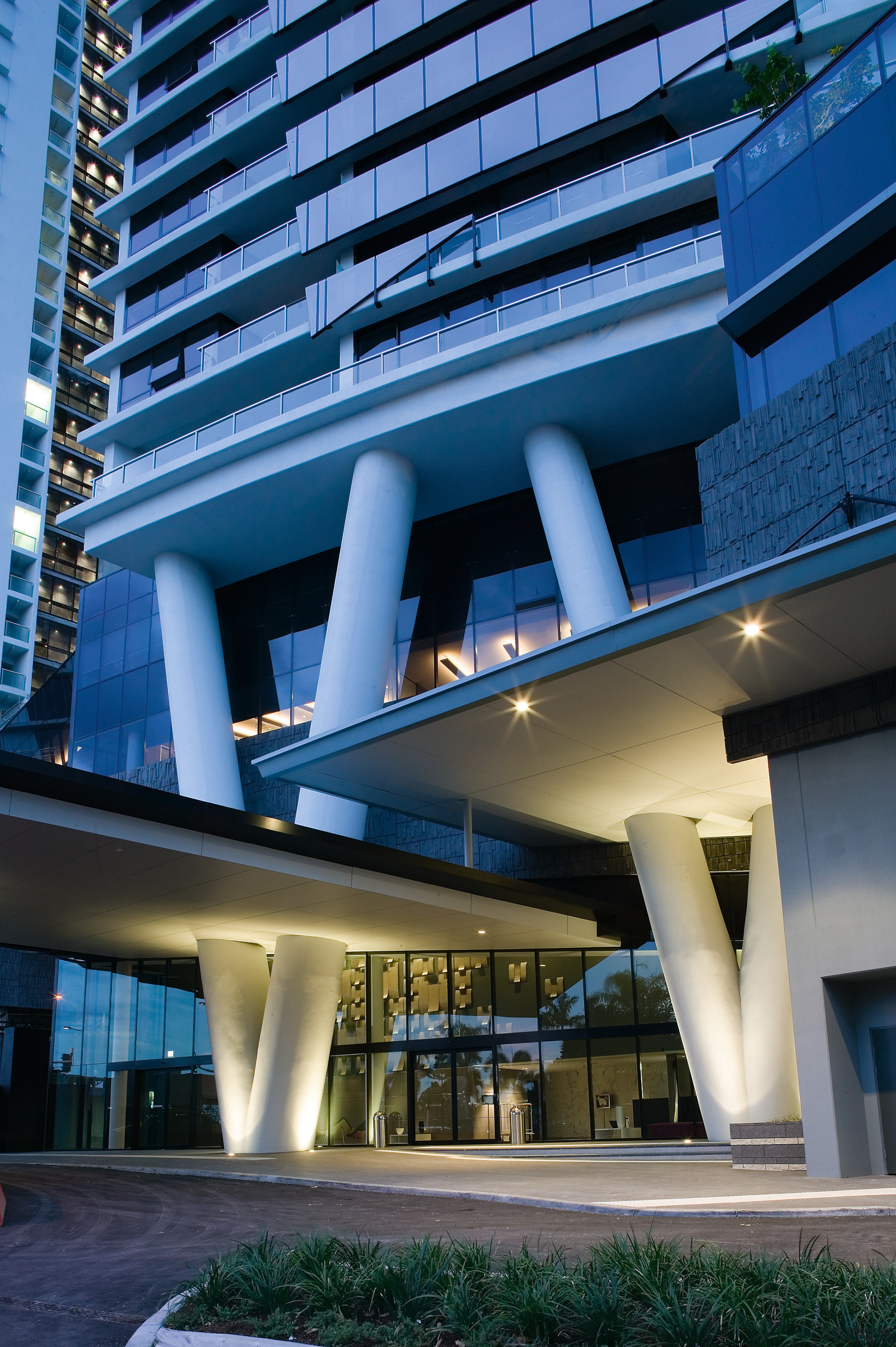 View of the steel columns that slice through apartment, architecture, building, commercial building, condominium, corporate headquarters, daytime, facade, headquarters, hotel, metropolitan area, mixed use, real estate, sky, skyscraper, blue