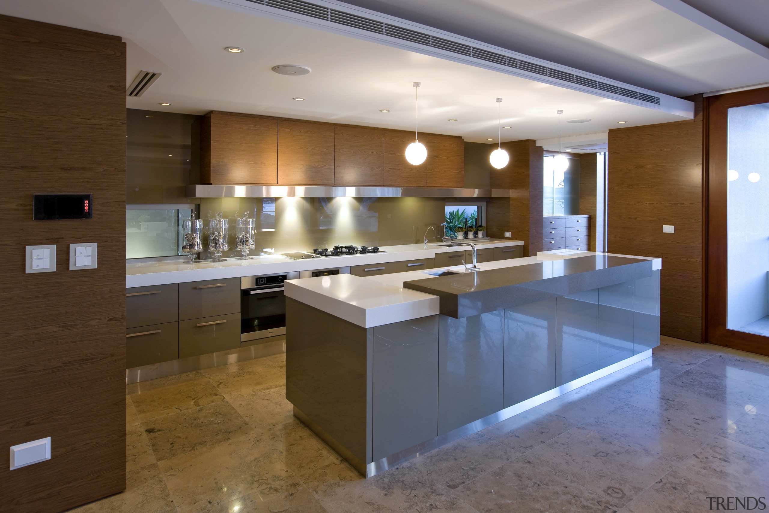 View of contemporary kitchen. - View of contemporary cabinetry, countertop, floor, flooring, interior design, kitchen, real estate, room, brown, gray