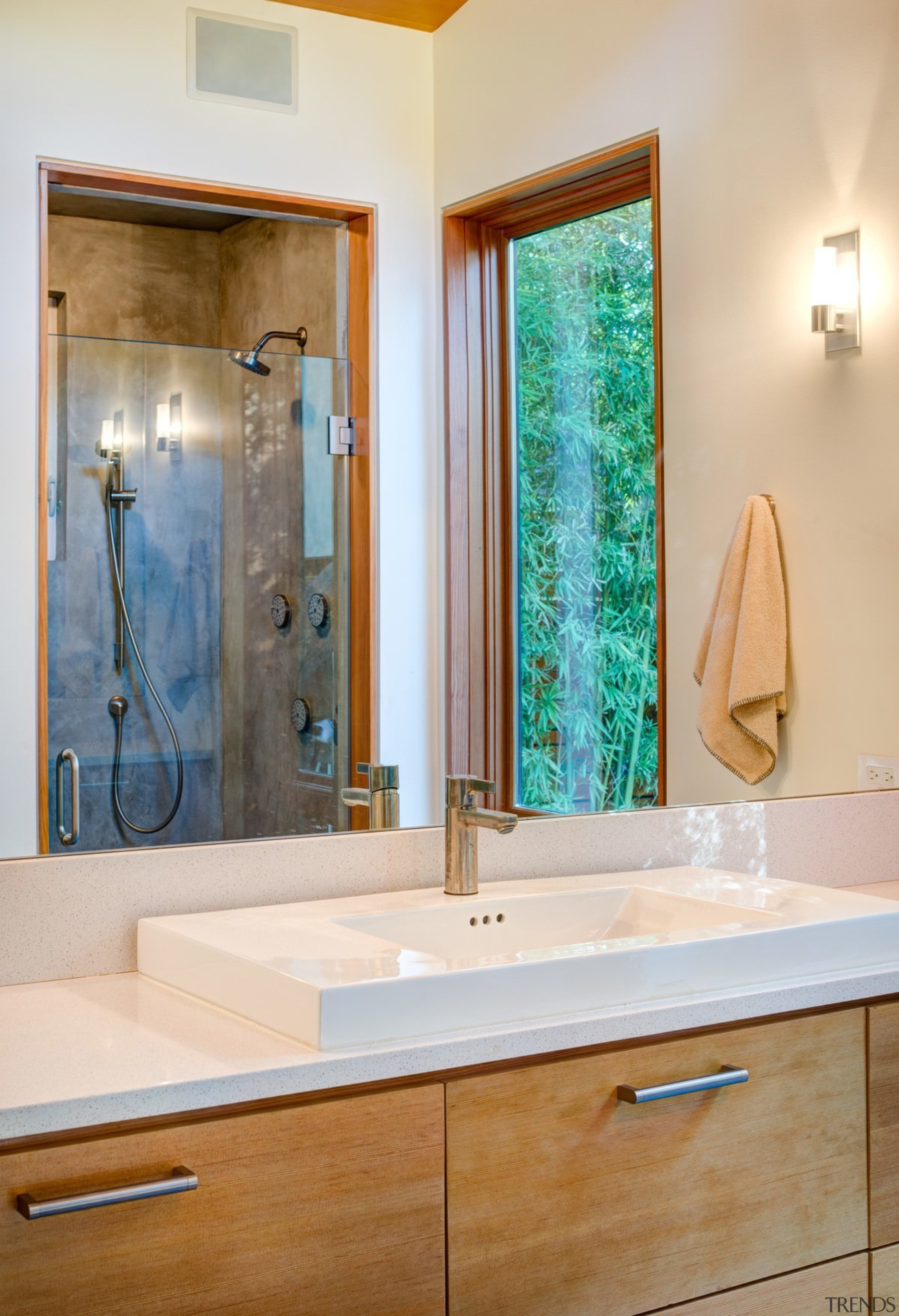 A (semi) private bathroom features a substantial mirror bathroom, bathroom accessory, bathroom cabinet, countertop, home, interior design, plumbing fixture, room, sink, gray