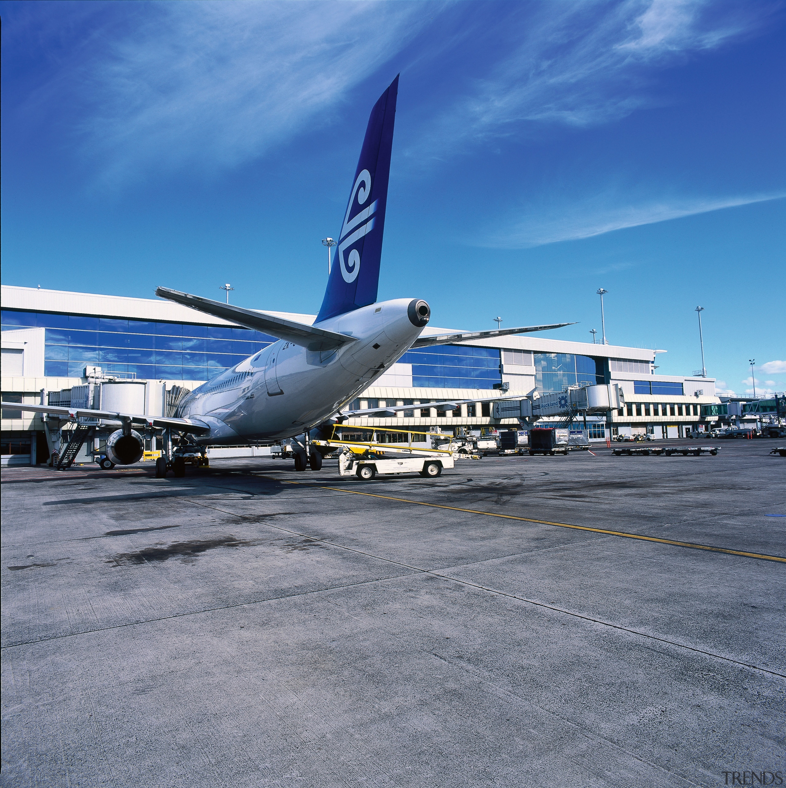 View of new passenger building with plane in aerospace engineering, air travel, airbus, airbus a320 family, airbus a330, aircraft, airline, airliner, airplane, airport, airport apron, airport terminal, aviation, boeing, boeing 737, boeing 767, boeing 777, daytime, flap, jet aircraft, narrow body aircraft, sky, transport, travel, wide body aircraft, blue, gray