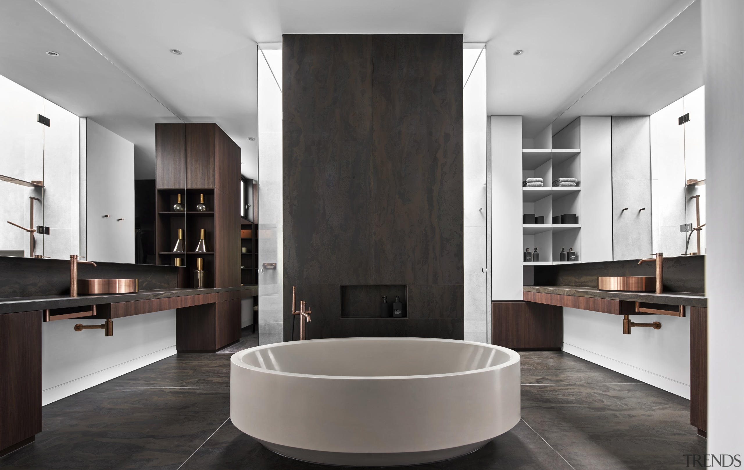 ​​​​​​​This symmetrical bathroom design puts the circular tub 