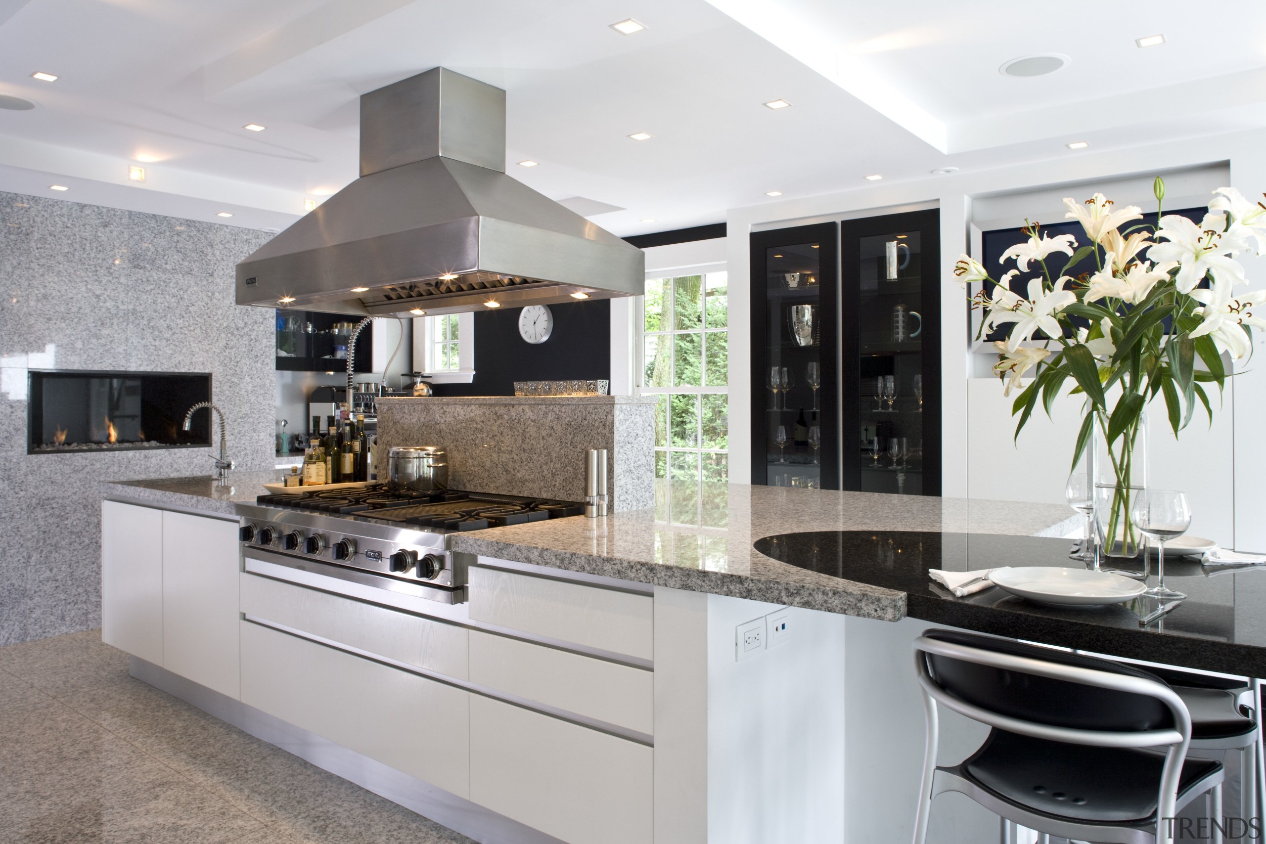 view of the kitchen with an in-wall fireplace, countertop, cuisine classique, interior design, kitchen, gray, white