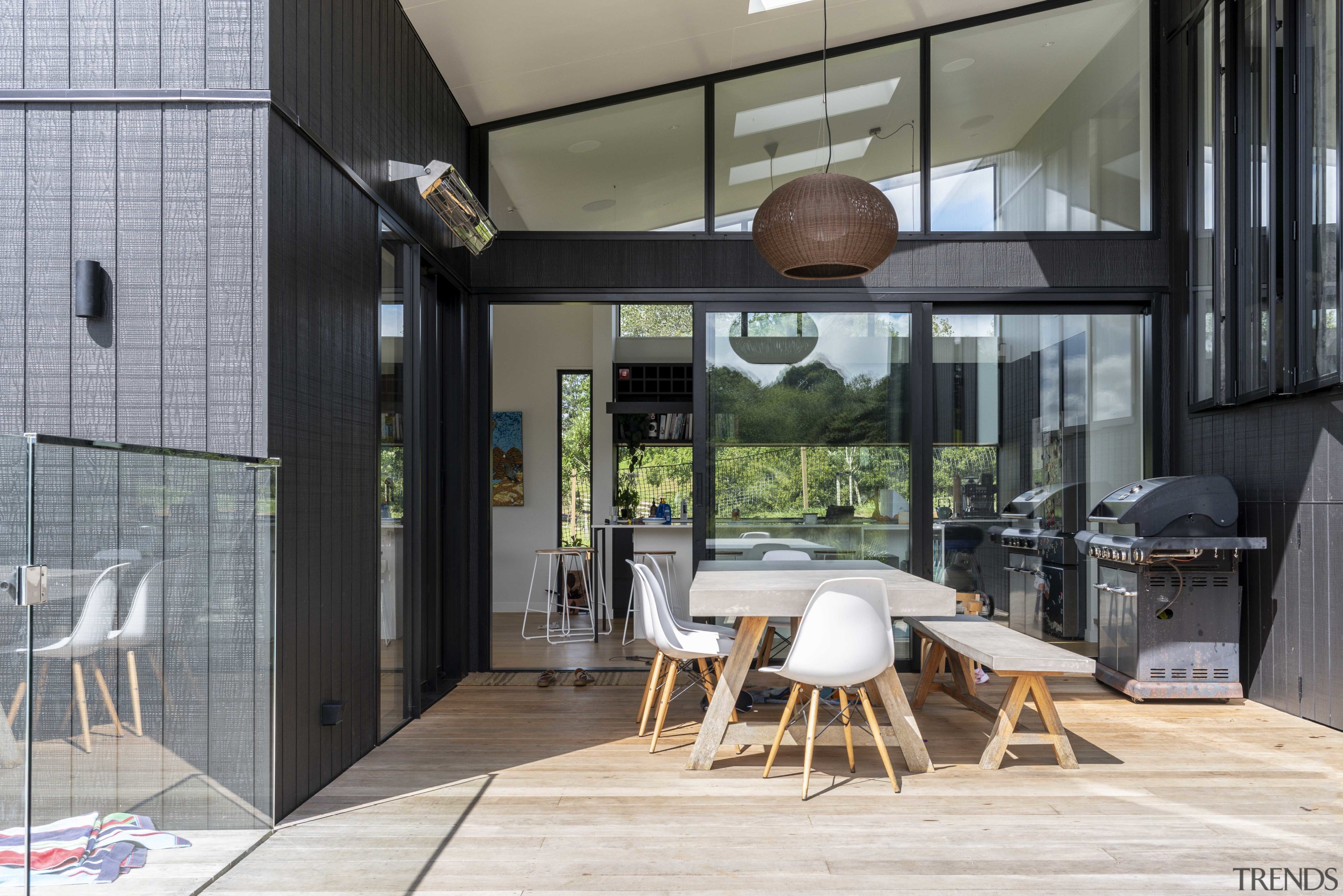 The U-shaped home embraces a covered central deck 