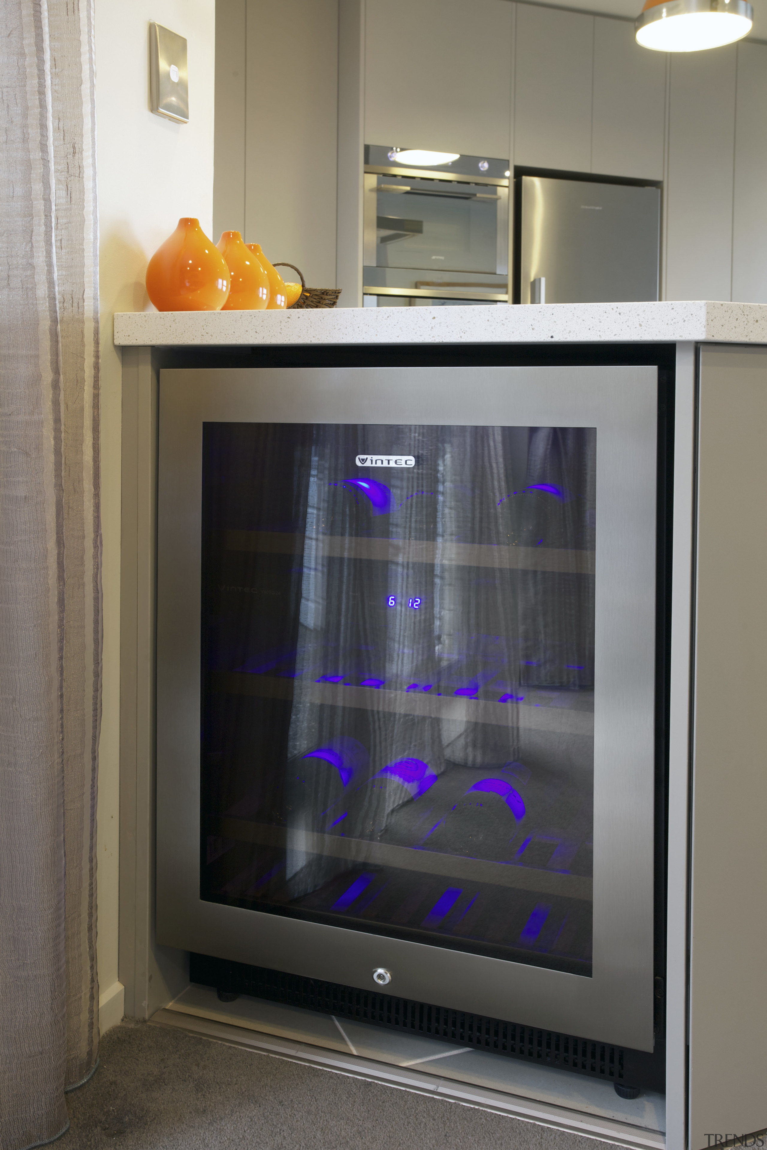 This new kitchen designed by Colleen Holder features display device, home appliance, kitchen appliance, major appliance, refrigerator, gray, black