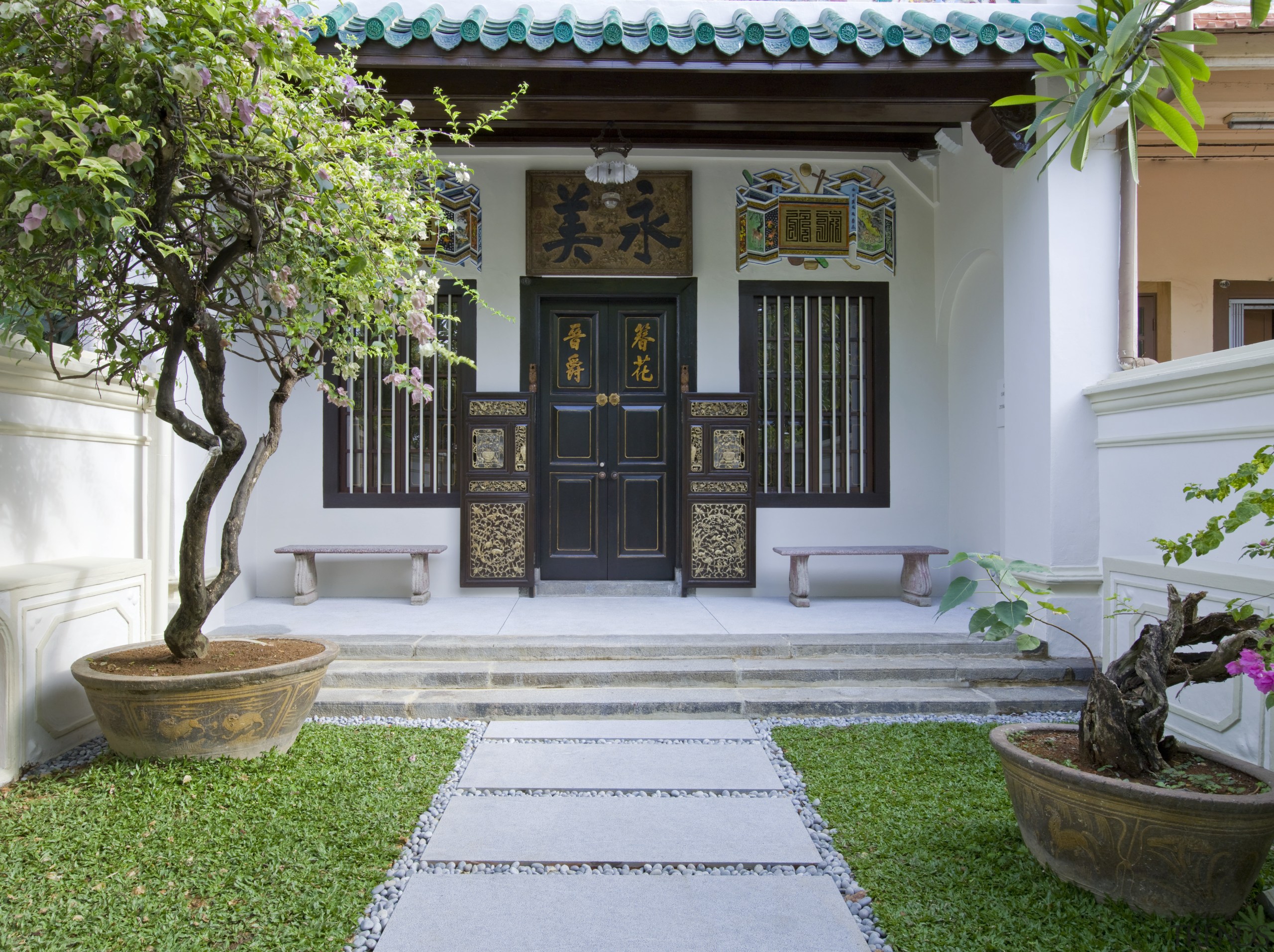 Exterior shot featuring entrance door - Exterior shot architecture, backyard, courtyard, estate, facade, garden, grass, home, house, landscaping, outdoor structure, plant, porch, property, real estate, residential area, walkway, yard, gray