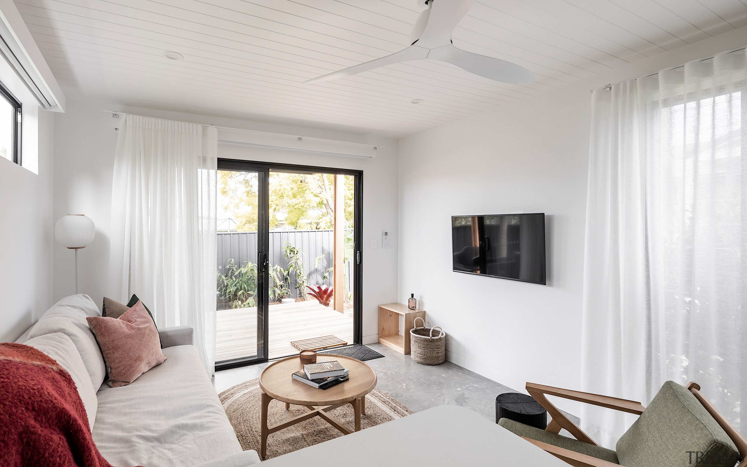 White on white living area with board ceiling, 