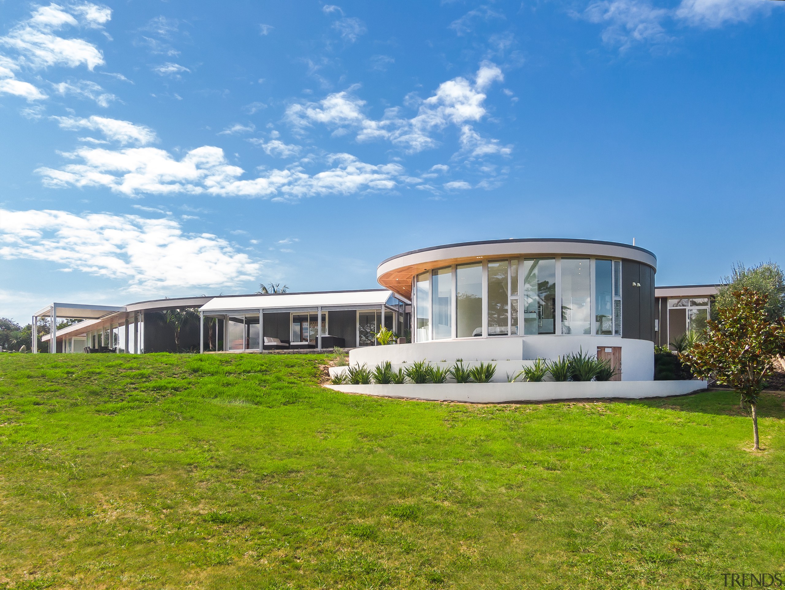 ​​​​​​​Cladding commonalities draw the new wings and existing teal