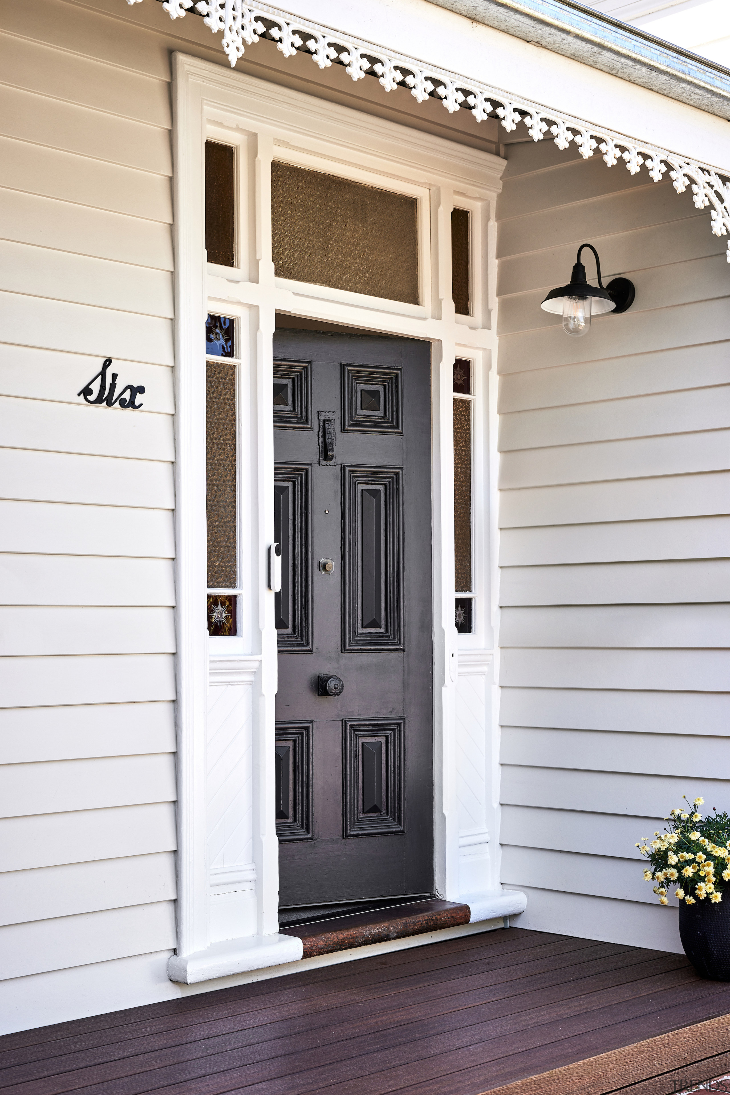 The retained classic front door. - Turning to 