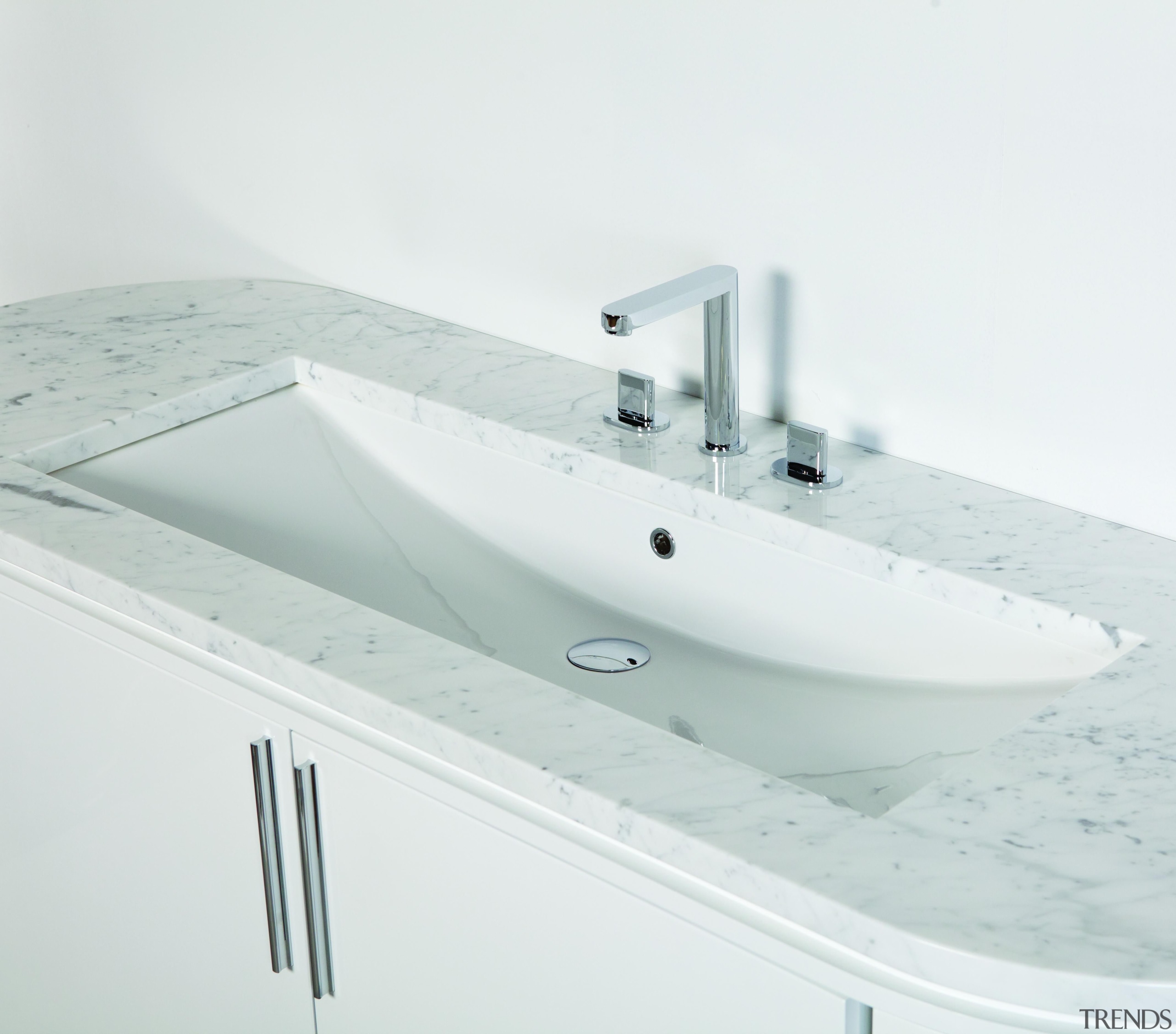 Under-counter porcelain lavatory with an overflow.001 white angle, bathroom sink, plumbing fixture, product design, sink, tap, white