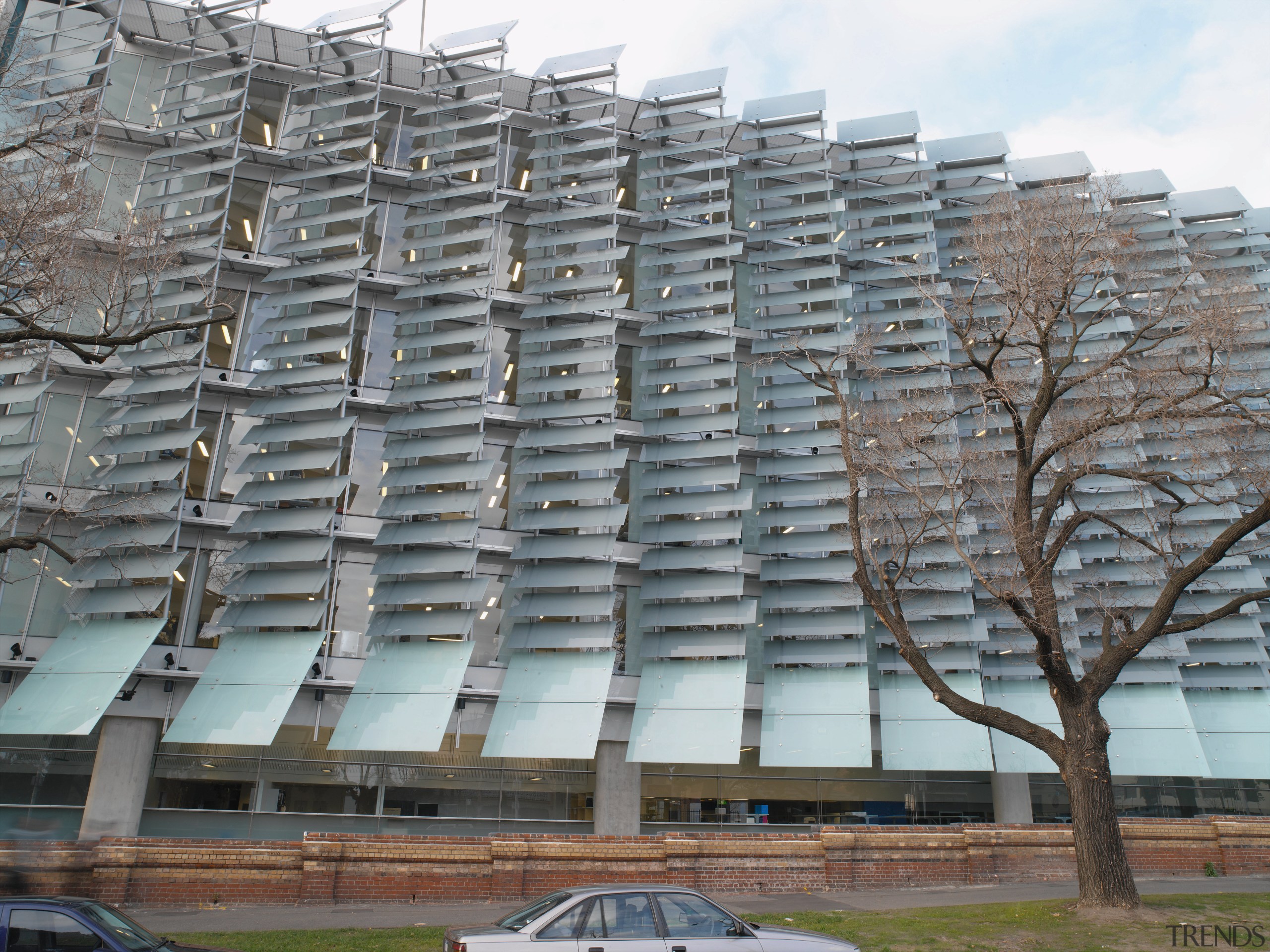 Exterior view of laboratory building showing wall of architecture, brutalist architecture, building, condominium, facade, mixed use, residential area, roof, structure, tower block, gray