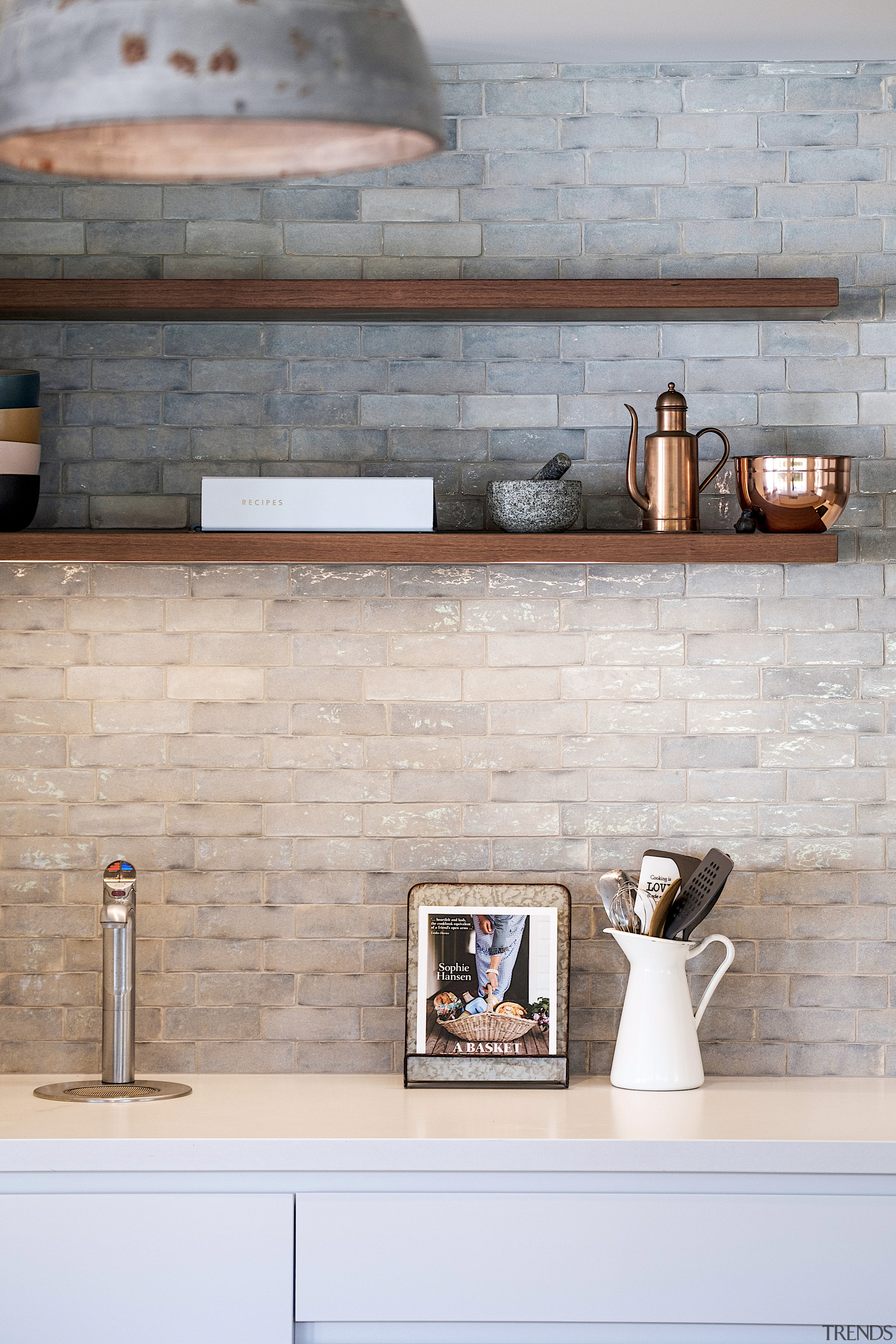 The rough contrasts the smooth in this kitchen 