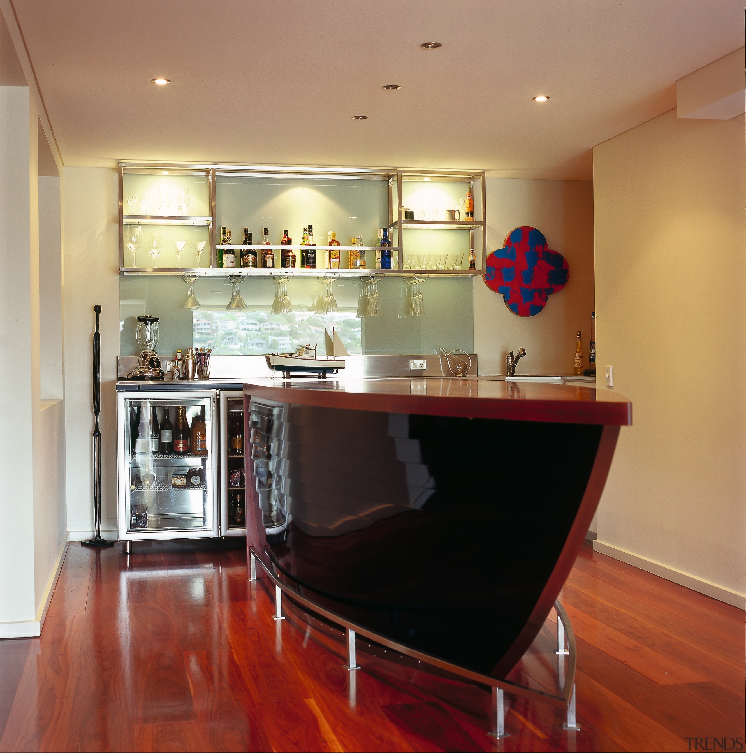 A view of the bar area with the cabinetry, ceiling, countertop, floor, flooring, hardwood, home, interior design, kitchen, real estate, room, table, orange