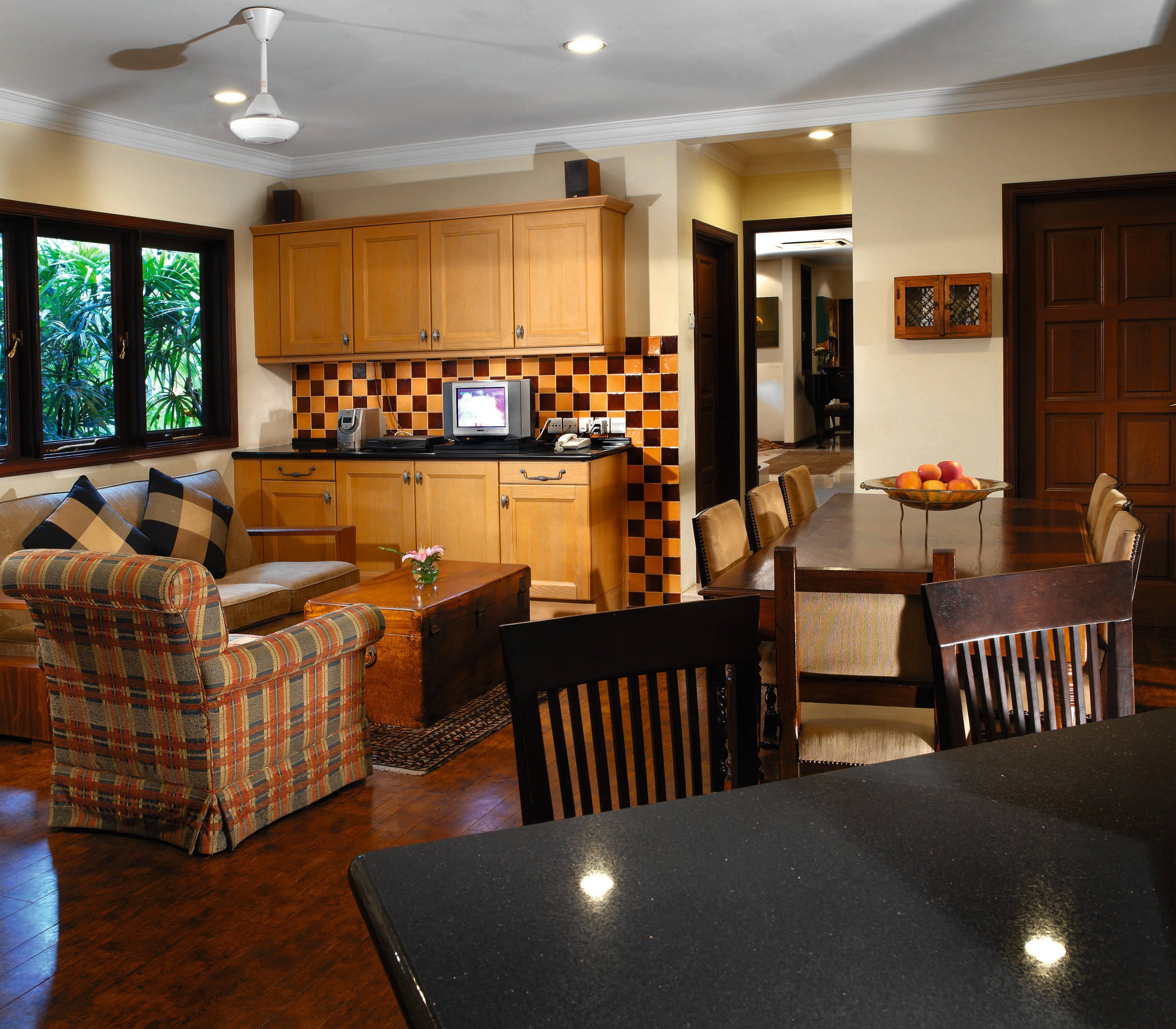 view of the kitchen and family area that home, interior design, kitchen, living room, real estate, room, table, brown, black