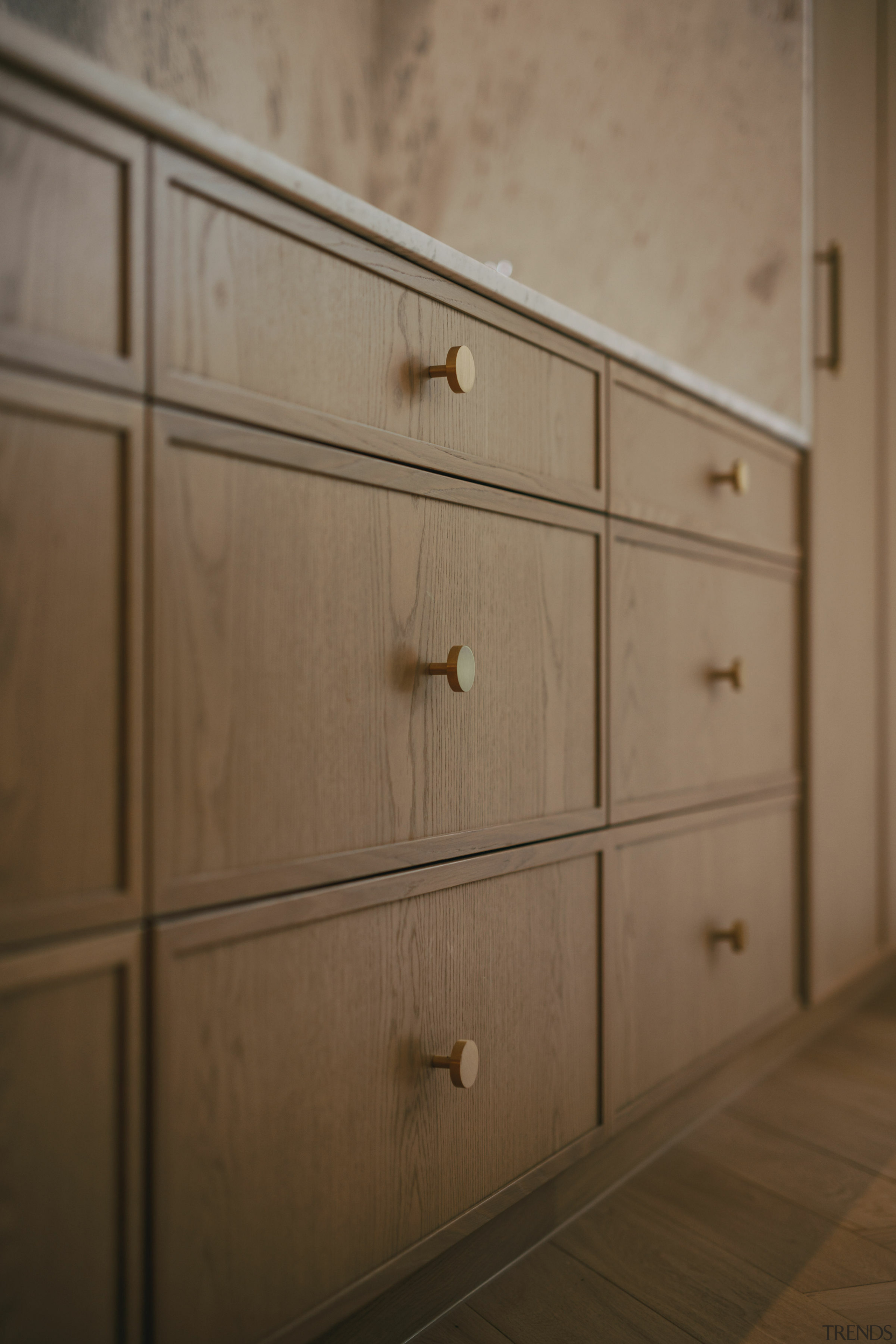 The Tasmanian oak veneer cabinetry with Lo and 