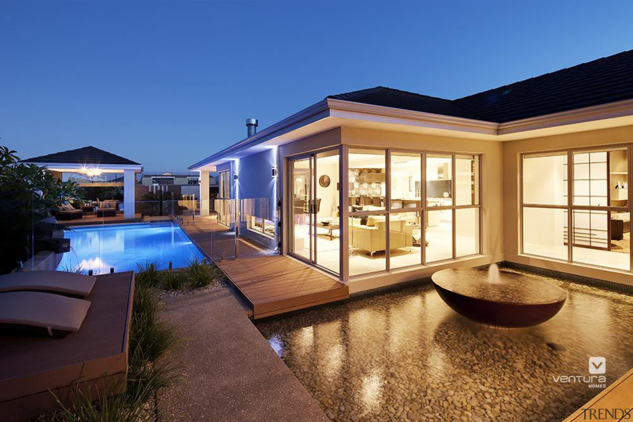 Backyard features water feature and swimming pool. apartment, estate, home, house, lighting, property, real estate, resort, swimming pool, villa, window, blue