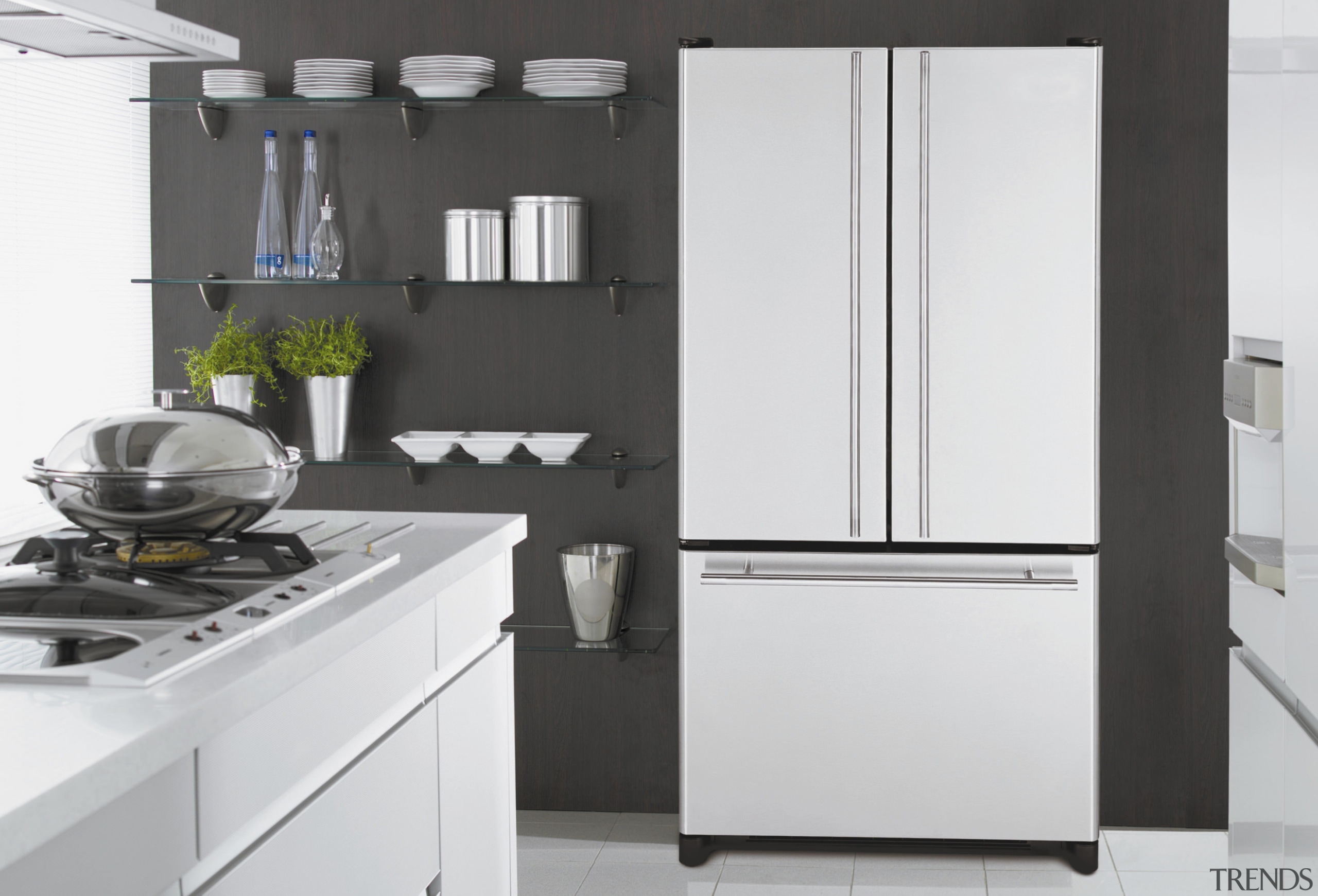 A view of some kitchen appliances by Maytag. countertop, home appliance, interior design, kitchen, kitchen appliance, kitchen stove, major appliance, product, product design, refrigerator, white, black