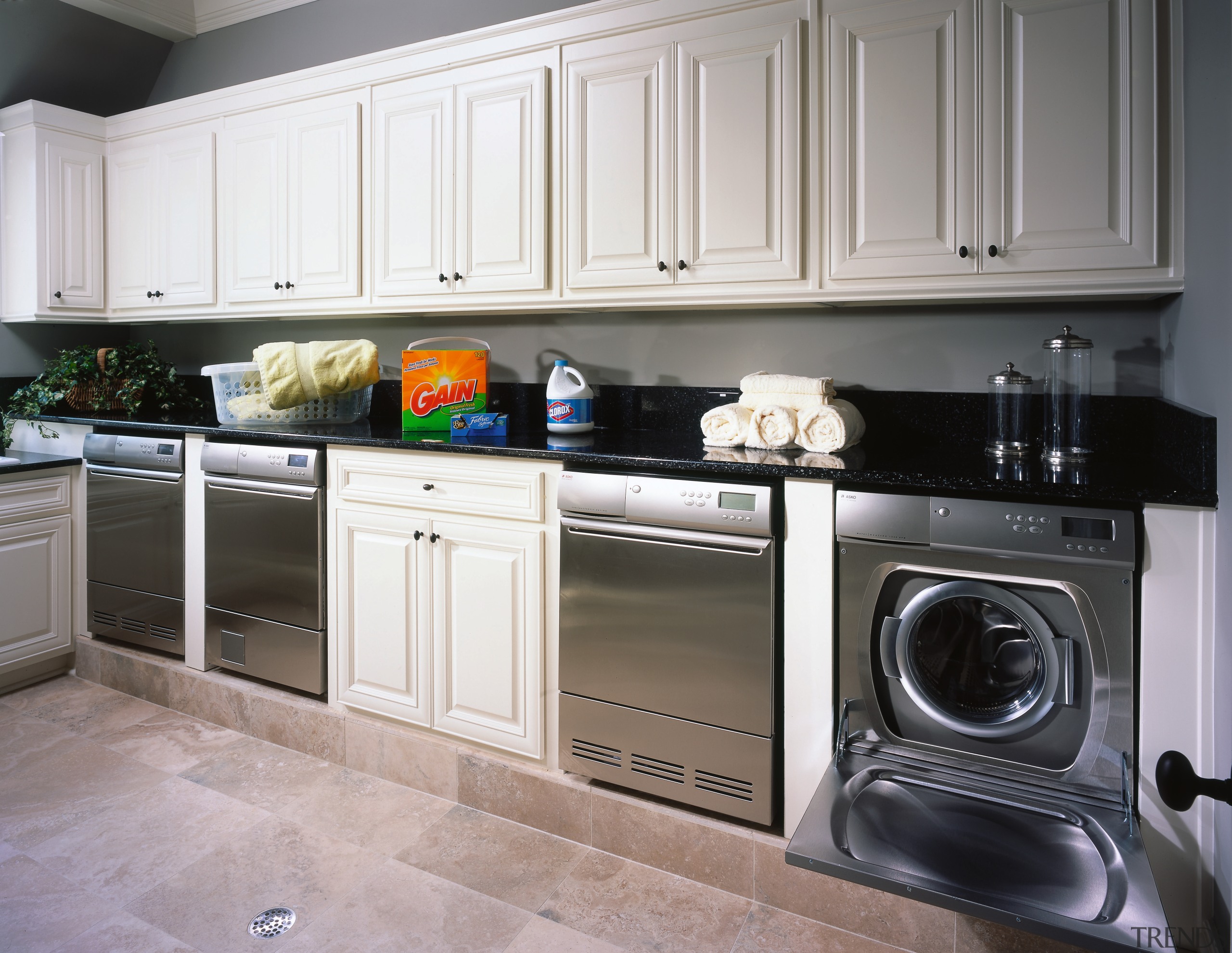 View of the laundry of this home - cabinetry, countertop, cuisine classique, home appliance, kitchen, kitchen appliance, kitchen stove, laundry room, major appliance, room, washing machine, gray