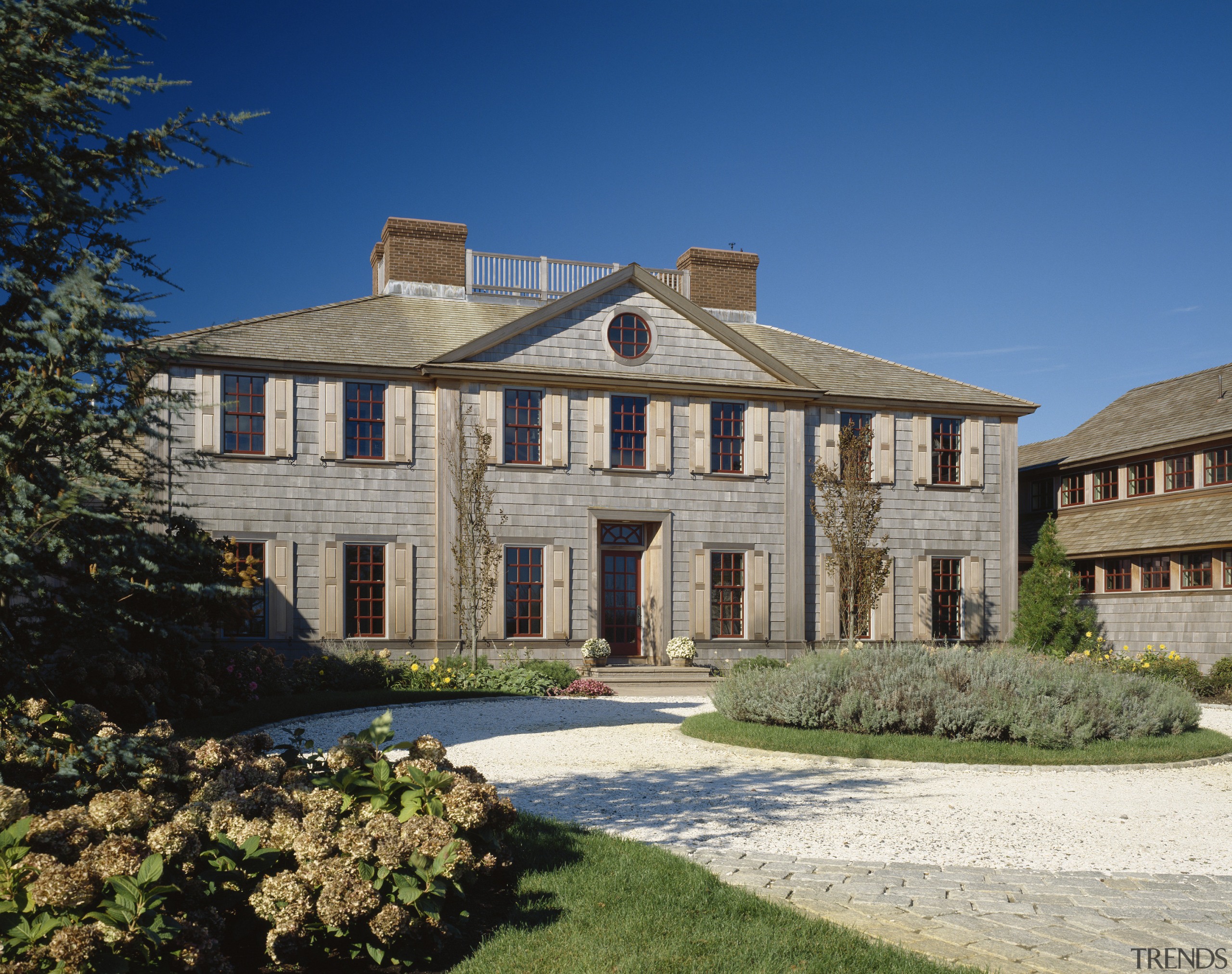 Exterior view of a large cottage with cedar architecture, building, cottage, estate, facade, farmhouse, historic house, home, house, manor house, mansion, national trust for places of historic interest or natural beauty, property, real estate, residential area, sky, stately home, suburb, villa, window