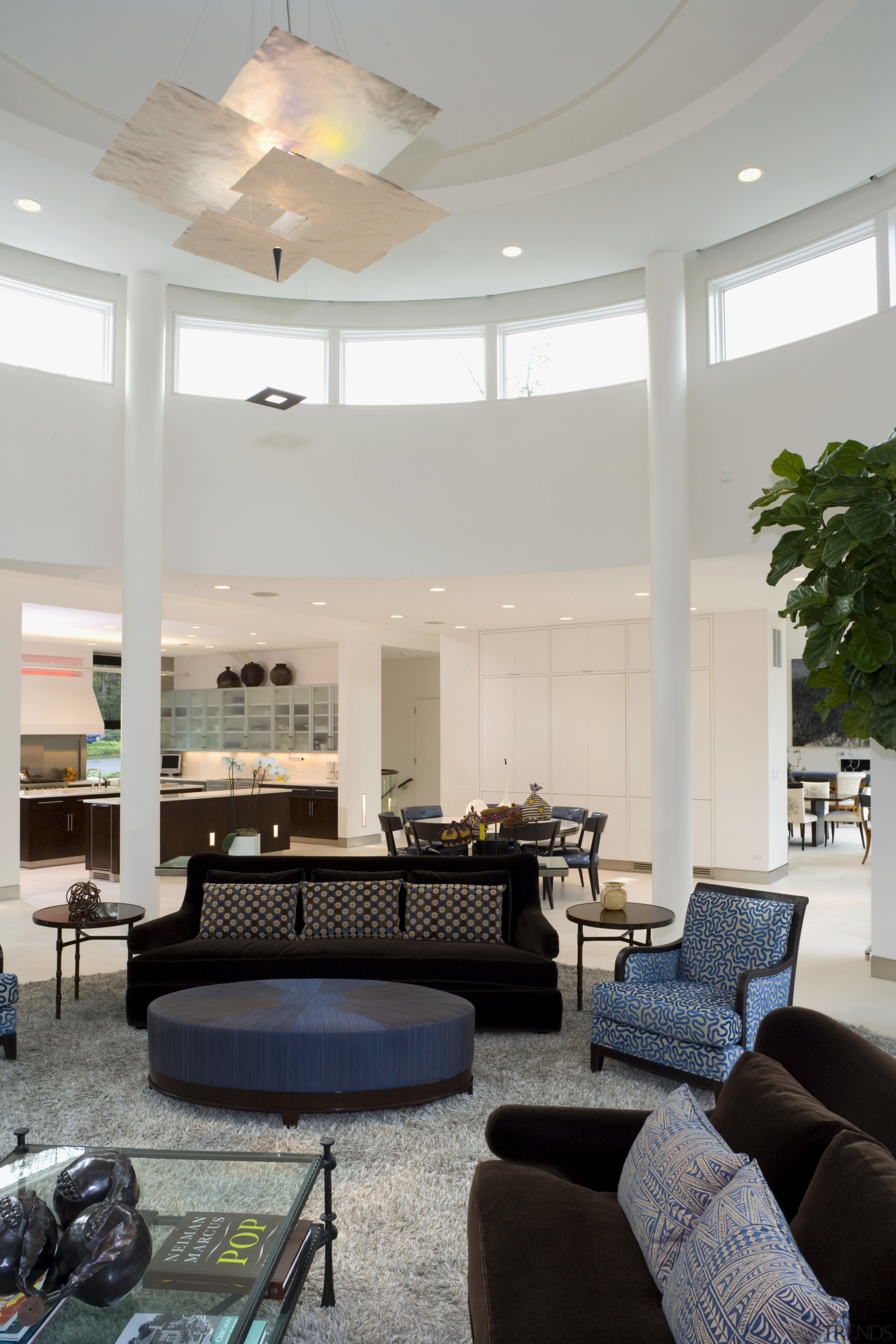 View of siting area, rug, brown couches, lighting, architecture, ceiling, daylighting, furniture, home, house, interior design, living room, lobby, real estate, room, table, window, gray