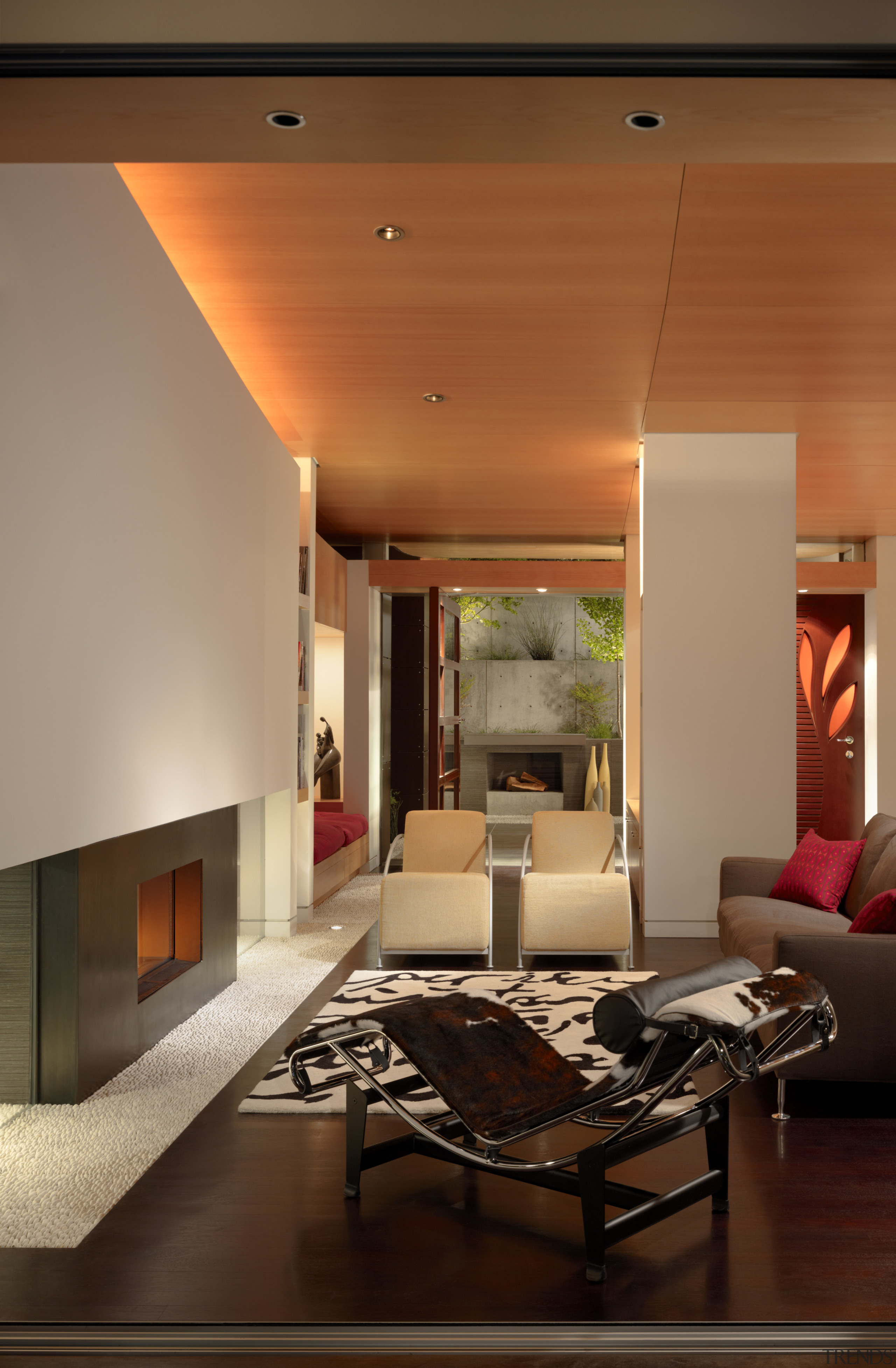 View of a living area with sofas, seating architecture, ceiling, floor, home, house, interior design, lighting, living room, lobby, room, table, wall, brown, orange